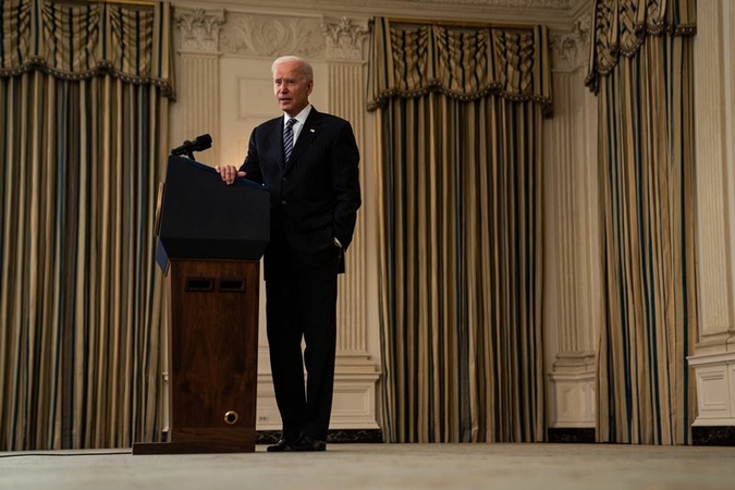 President Joe Biden answers a question from a reporter Tuesday after giving remarks at the White House on the U.S. vaccination effort. MUST CREDIT: Washington Post photo by Demetrius Freeman