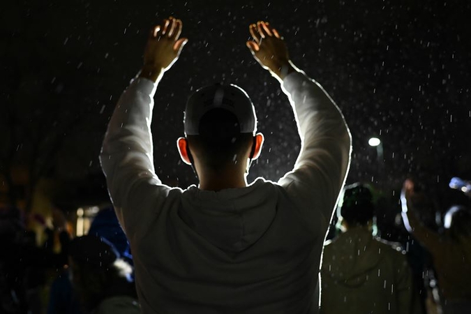 Demonstrators protest the fatal police shooting of Daunte Wright outside the Brooklyn Center Police Station on April 11, 2021 in Brooklyn Center, Minnesota. MUST CREDIT: