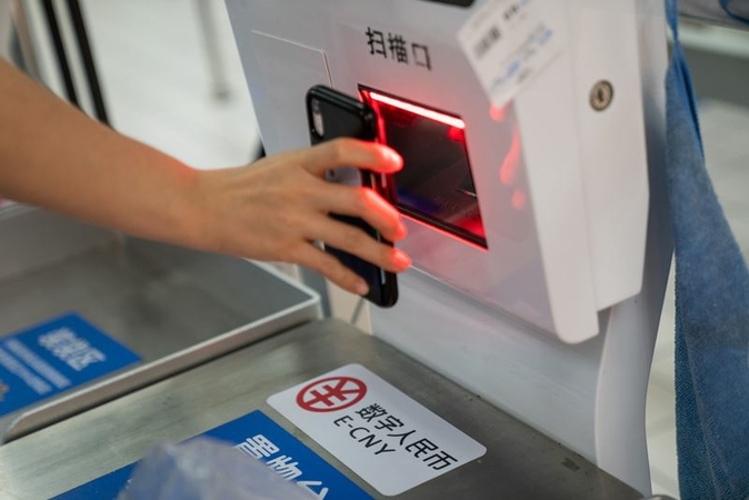 Signage for the digital yuan, or E-CNY, at self check-out counter at supermarket in Shenzhen, China, Nov. 20, 2020. MUST CREDIT: Bloomberg photo by Yan Cong