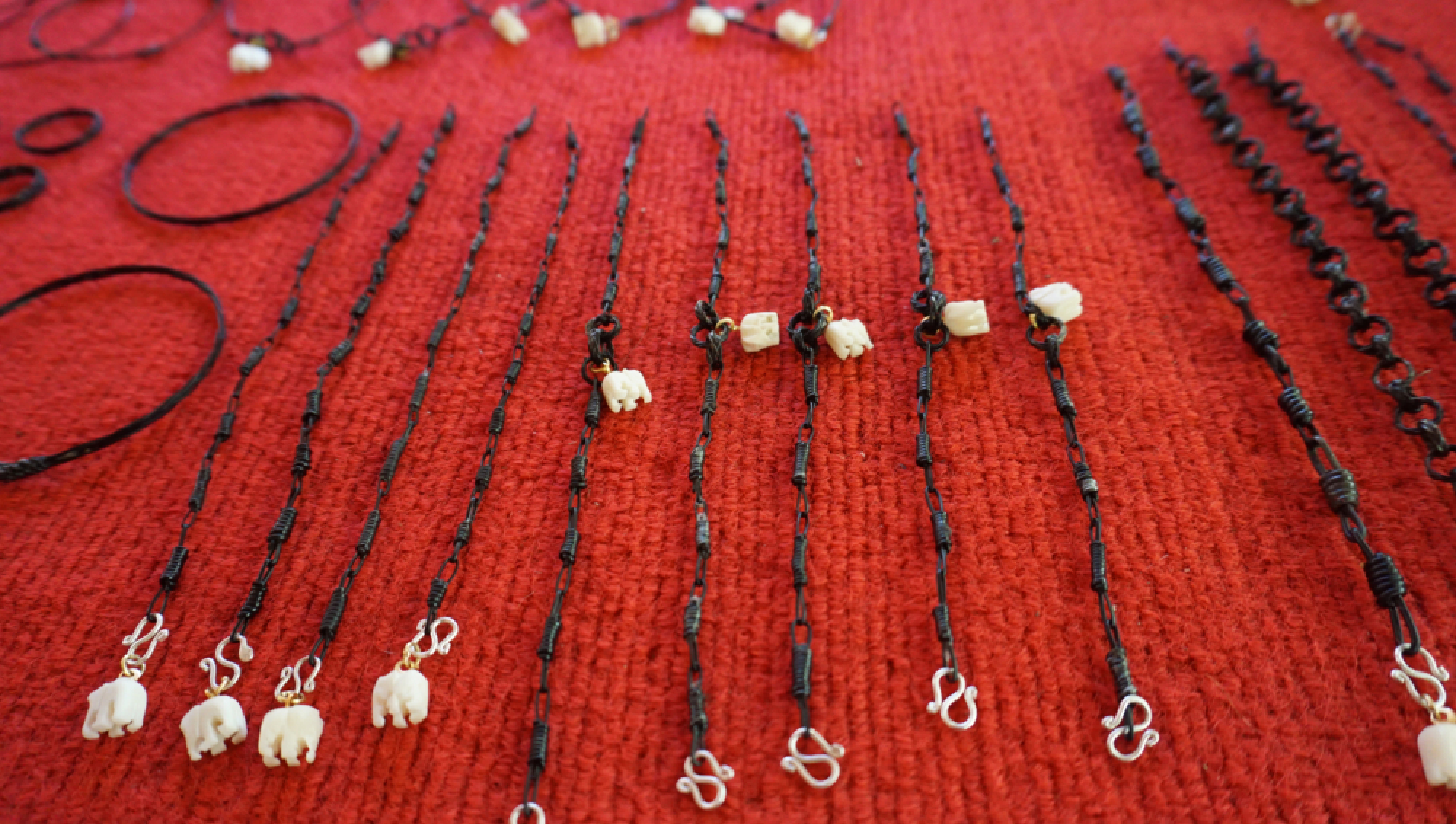 Necklaces, bracelets and rings made from elephant teeth and hairs that fall naturally are available at Anantara Golden Triangle Elephant Camp and Resort. Nation/Chusri Ngam Prasert