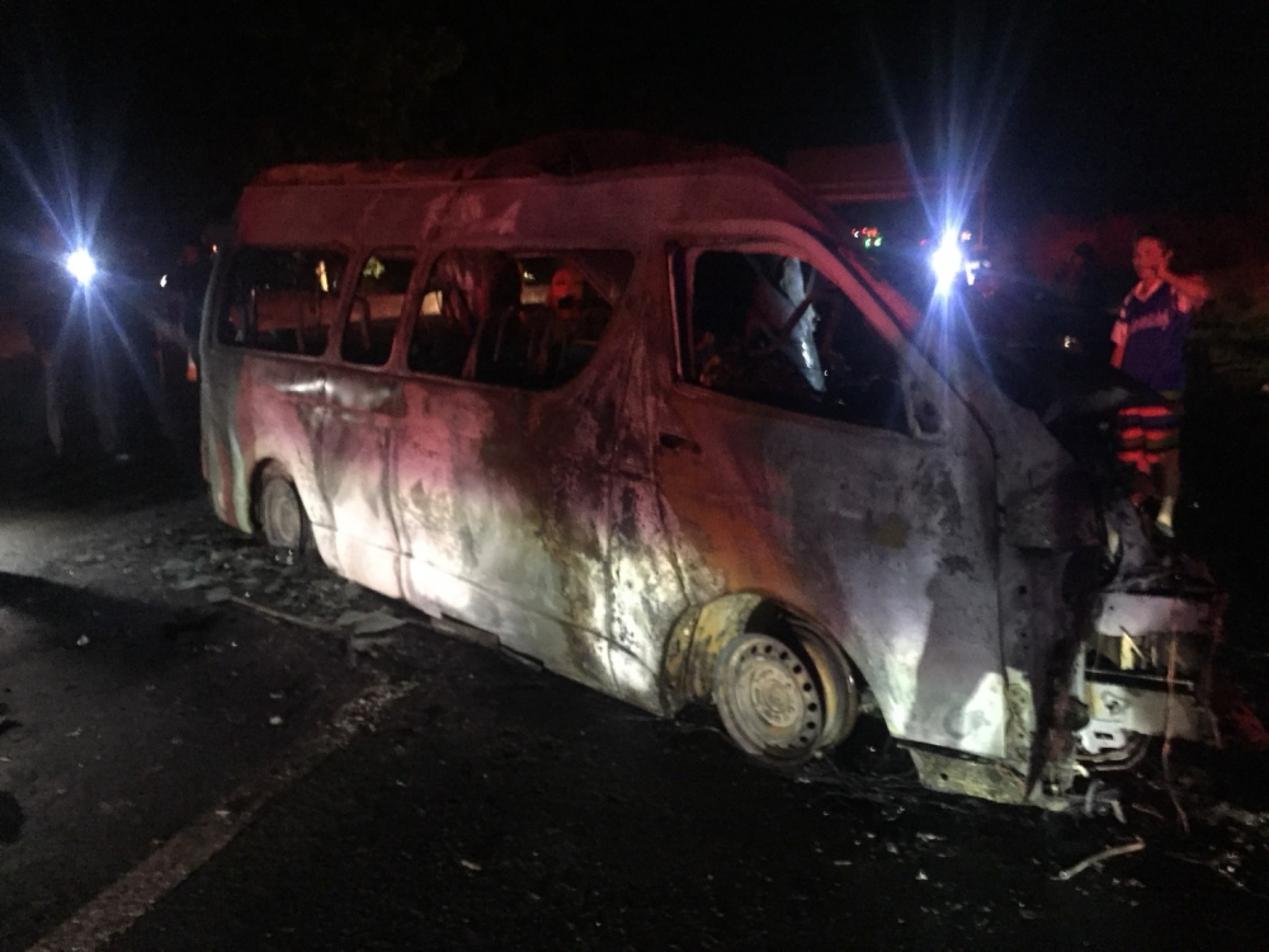 Fourteen killed as van bursts into flames after crash in Sing Buri