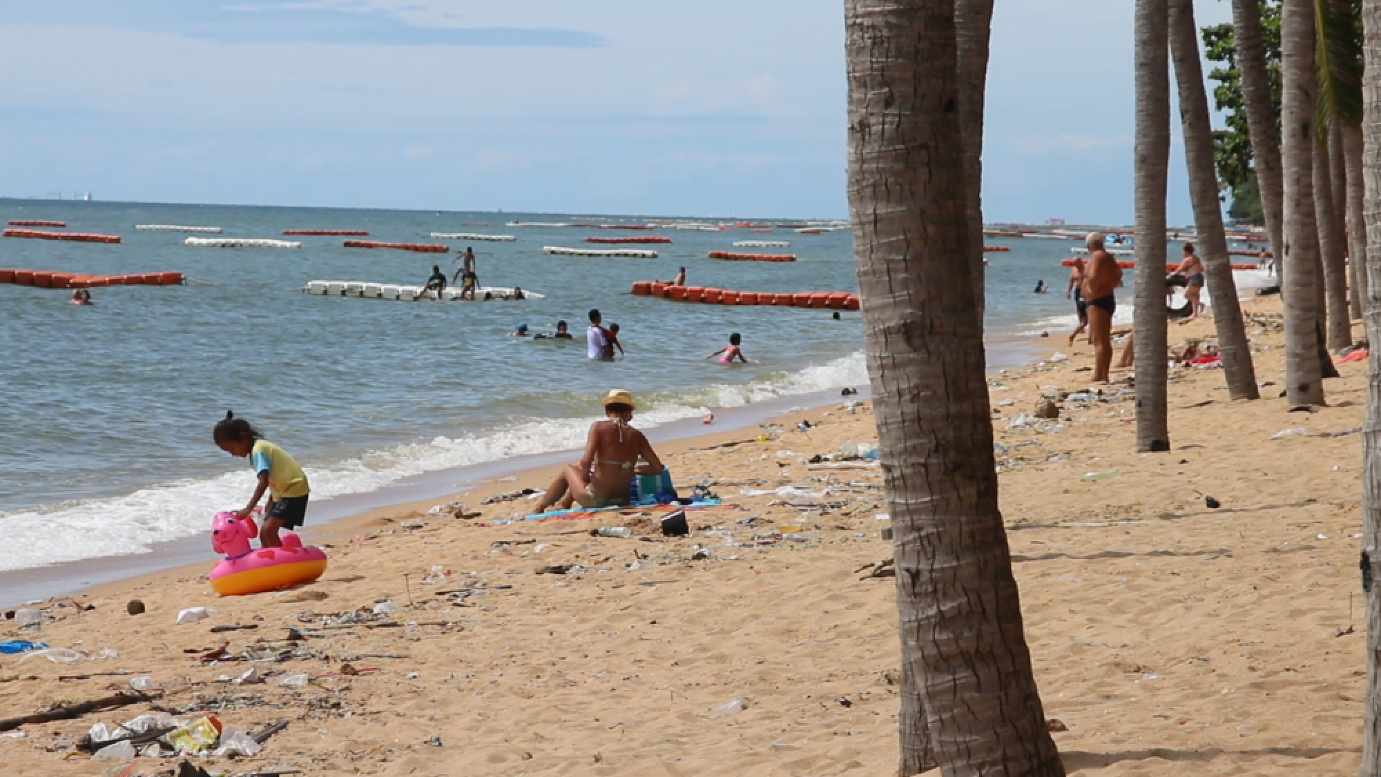 Garbage-strewn scene at Jomtien Beach after floodwater drains out to sea