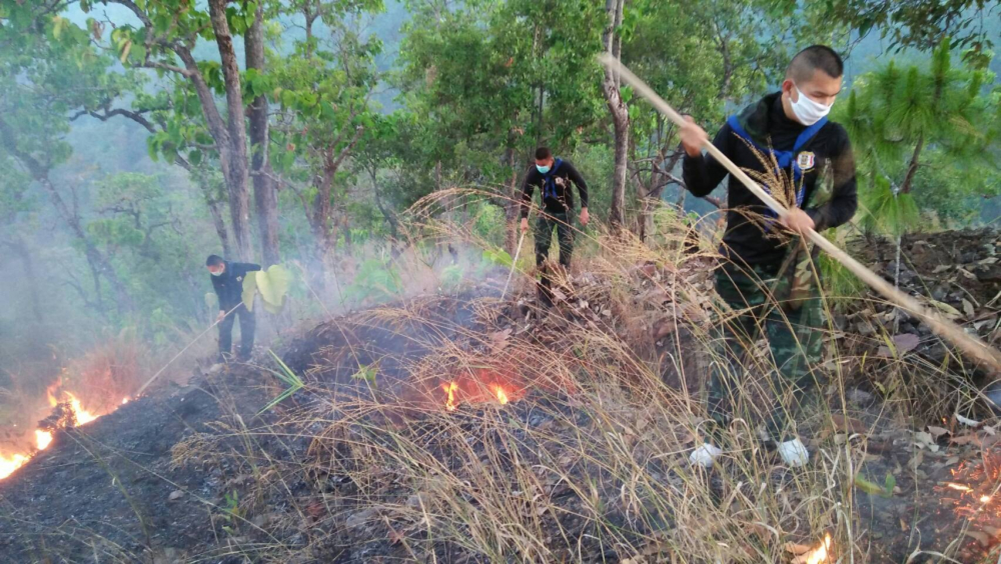 Rain abates, fires foul air in North