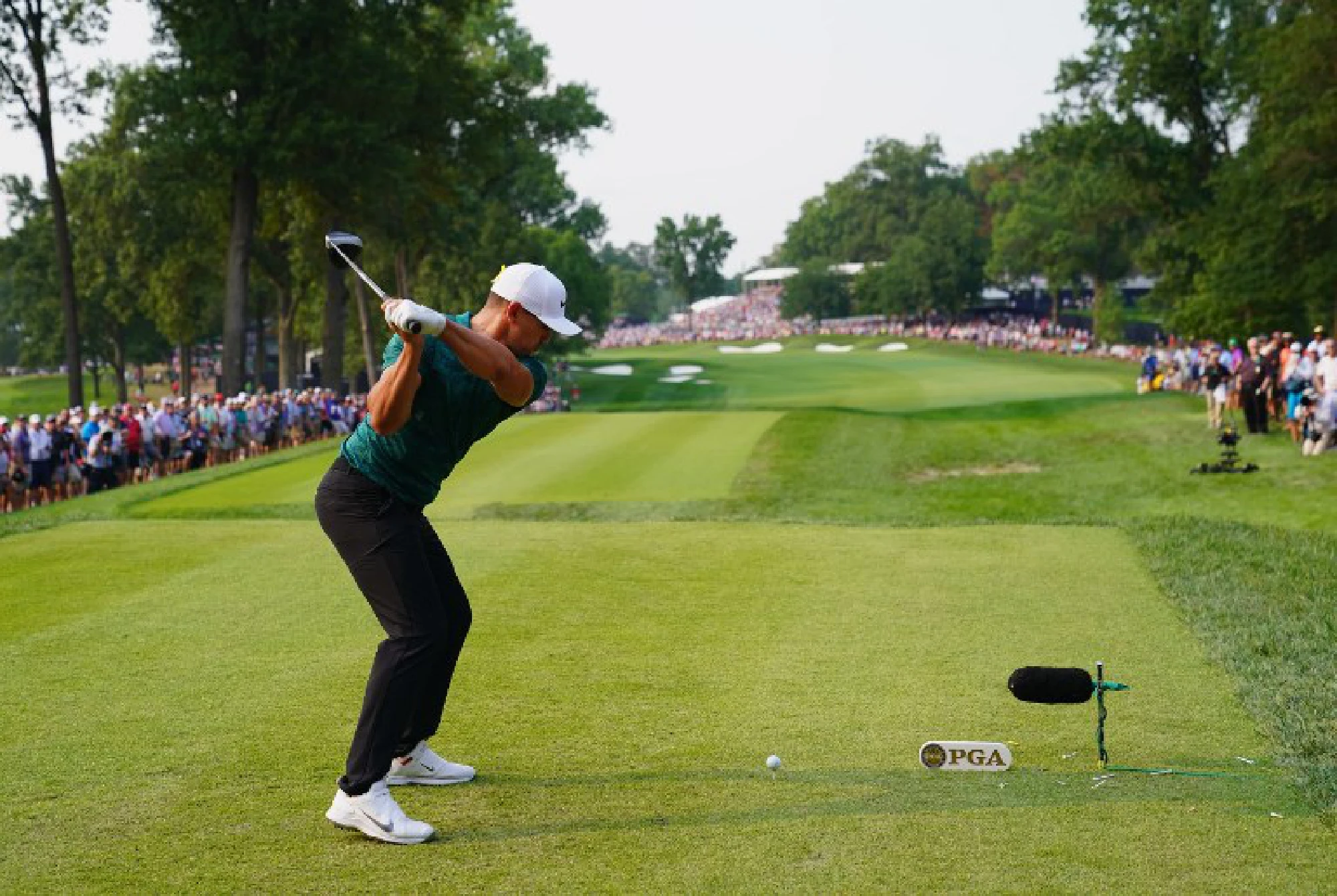 Koepka holds off Woods to win 100th PGA Championship