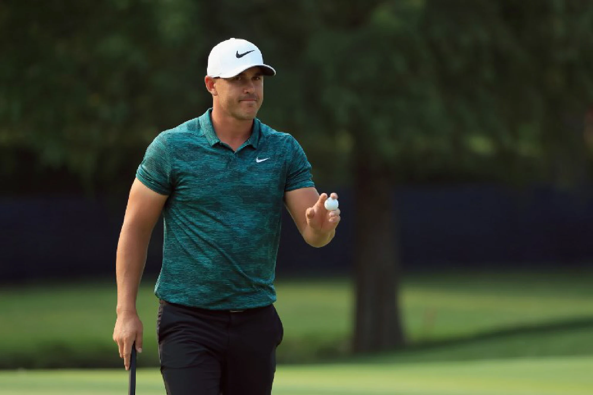 Koepka holds off Woods to win 100th PGA Championship