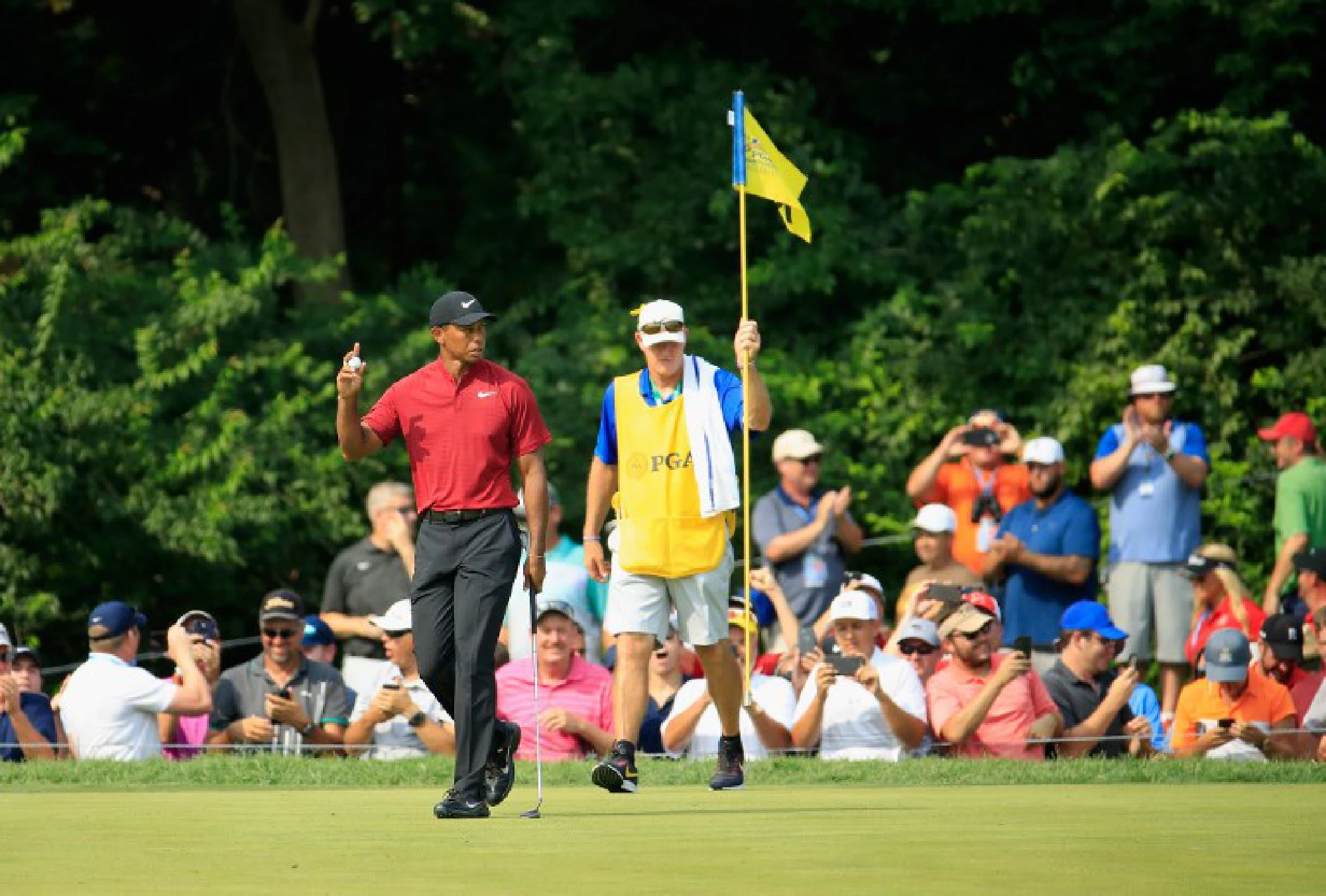 Koepka holds off Woods to win 100th PGA Championship