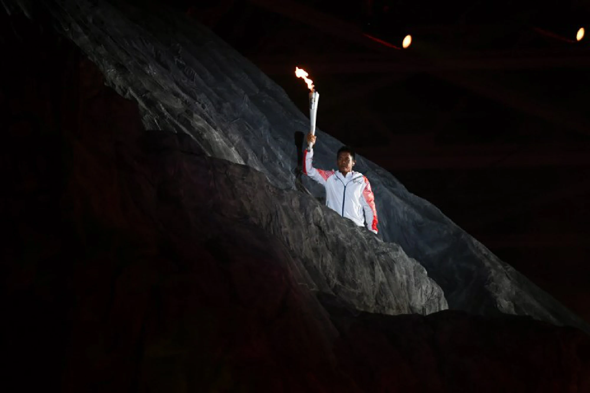 Two Koreas march together as Asian Games burst into life