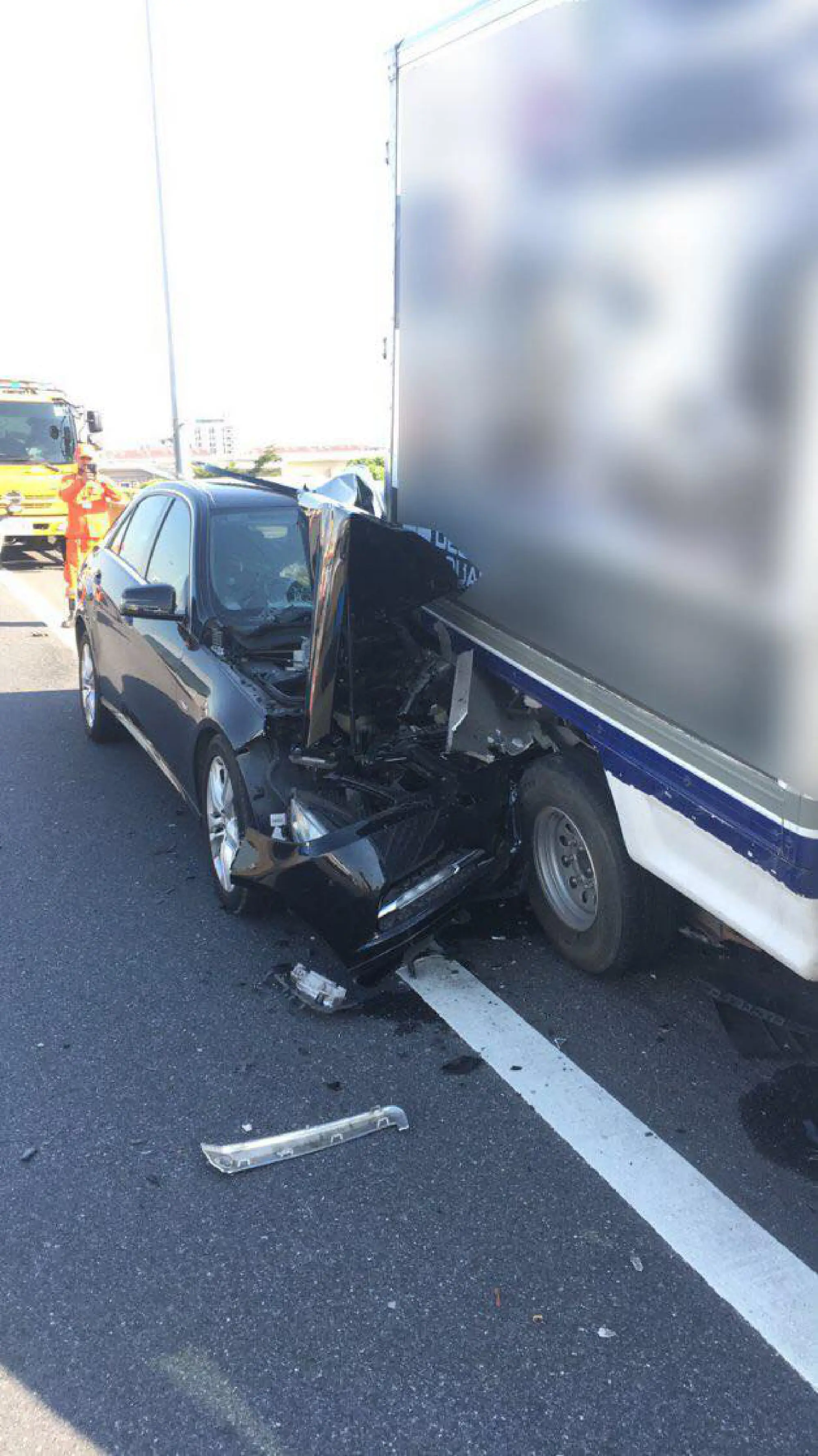 Two workers die in fall from expressway as car hits furniture truck
