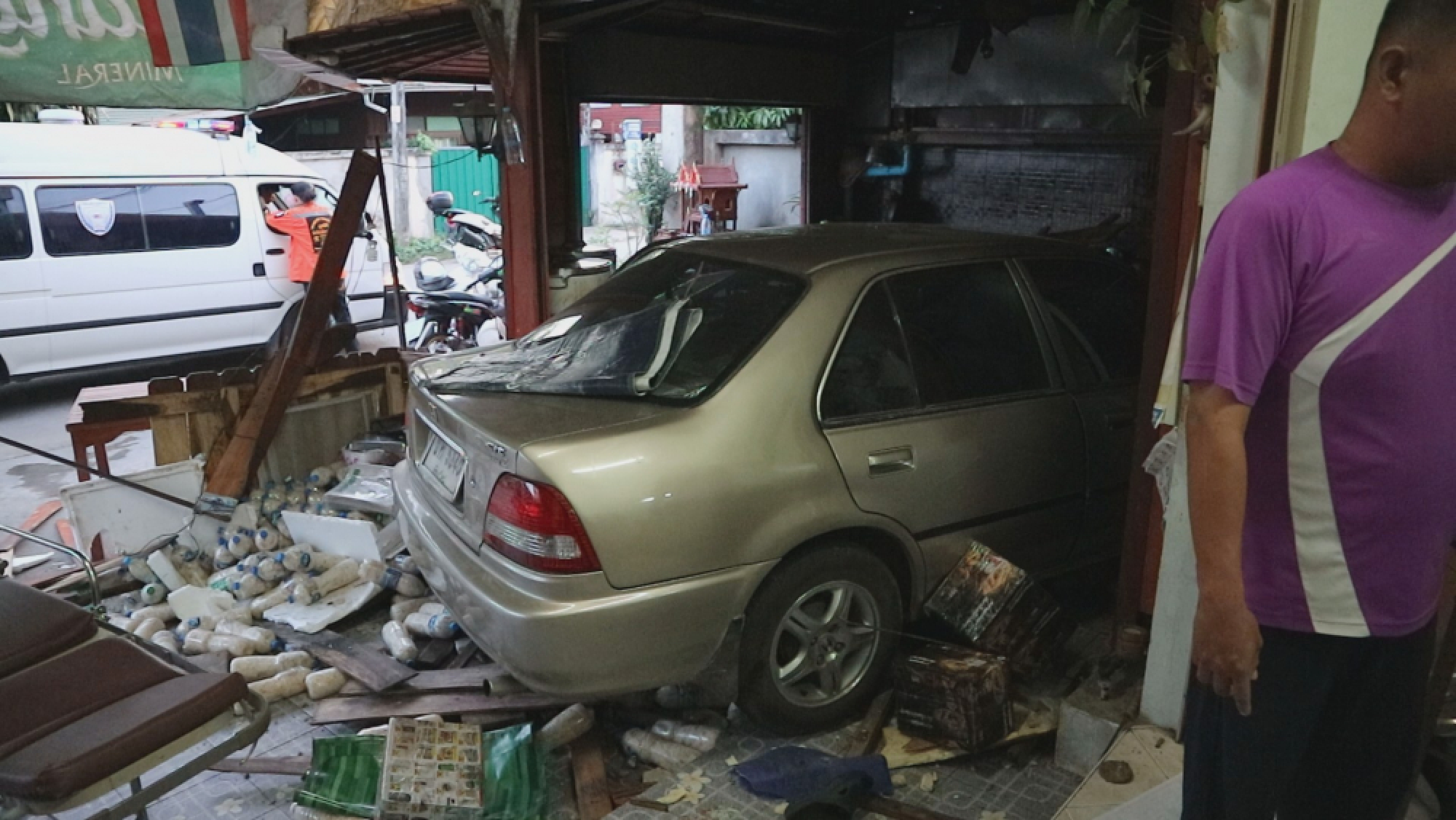 Two injured as car barrels into Tak food shop