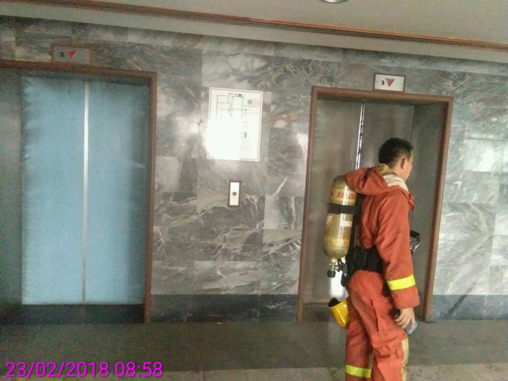 Foreign guests flee as smoke pours from two hotel lifts