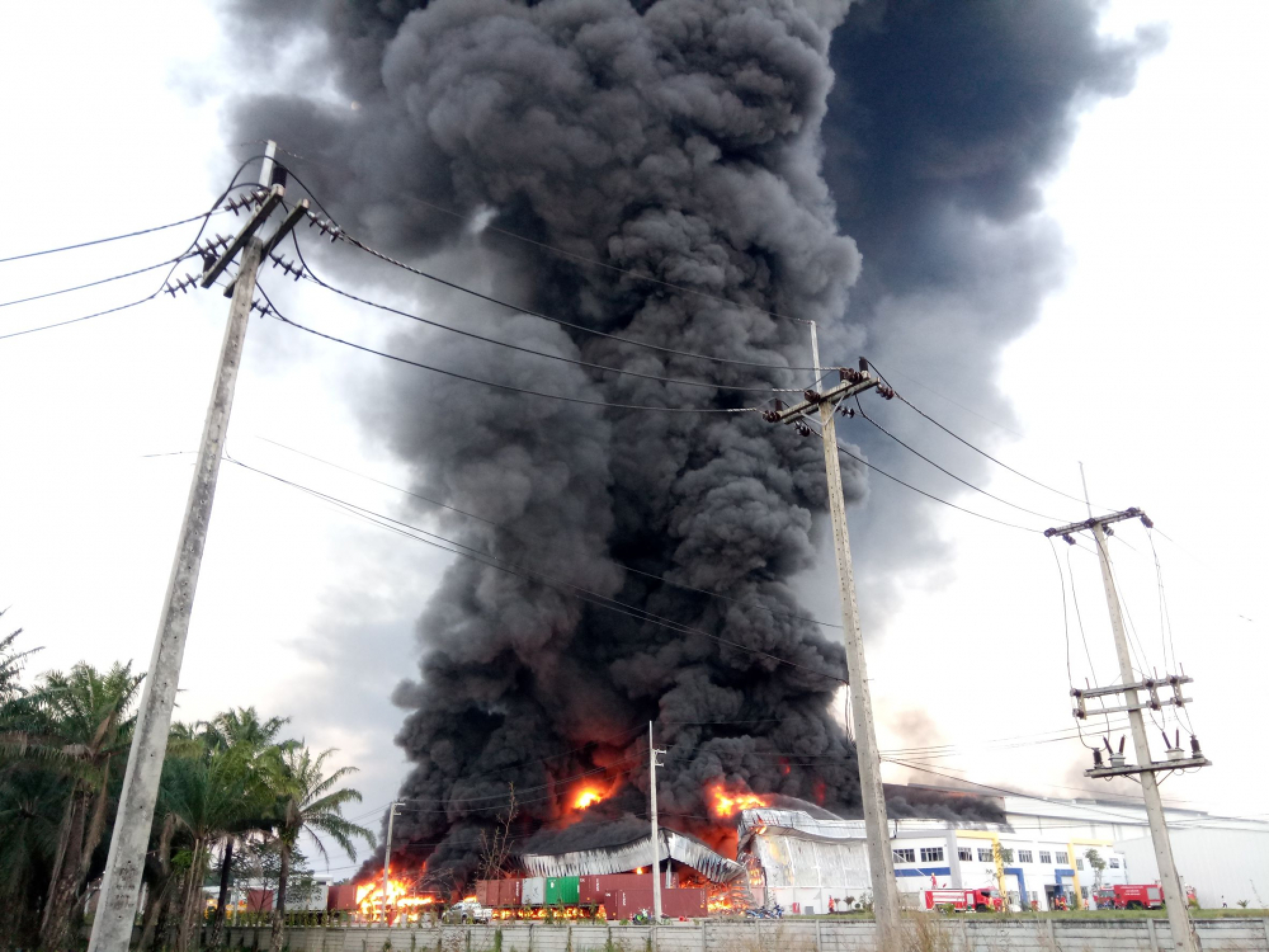 Thick smoke visible for kilometres as massive factory burns