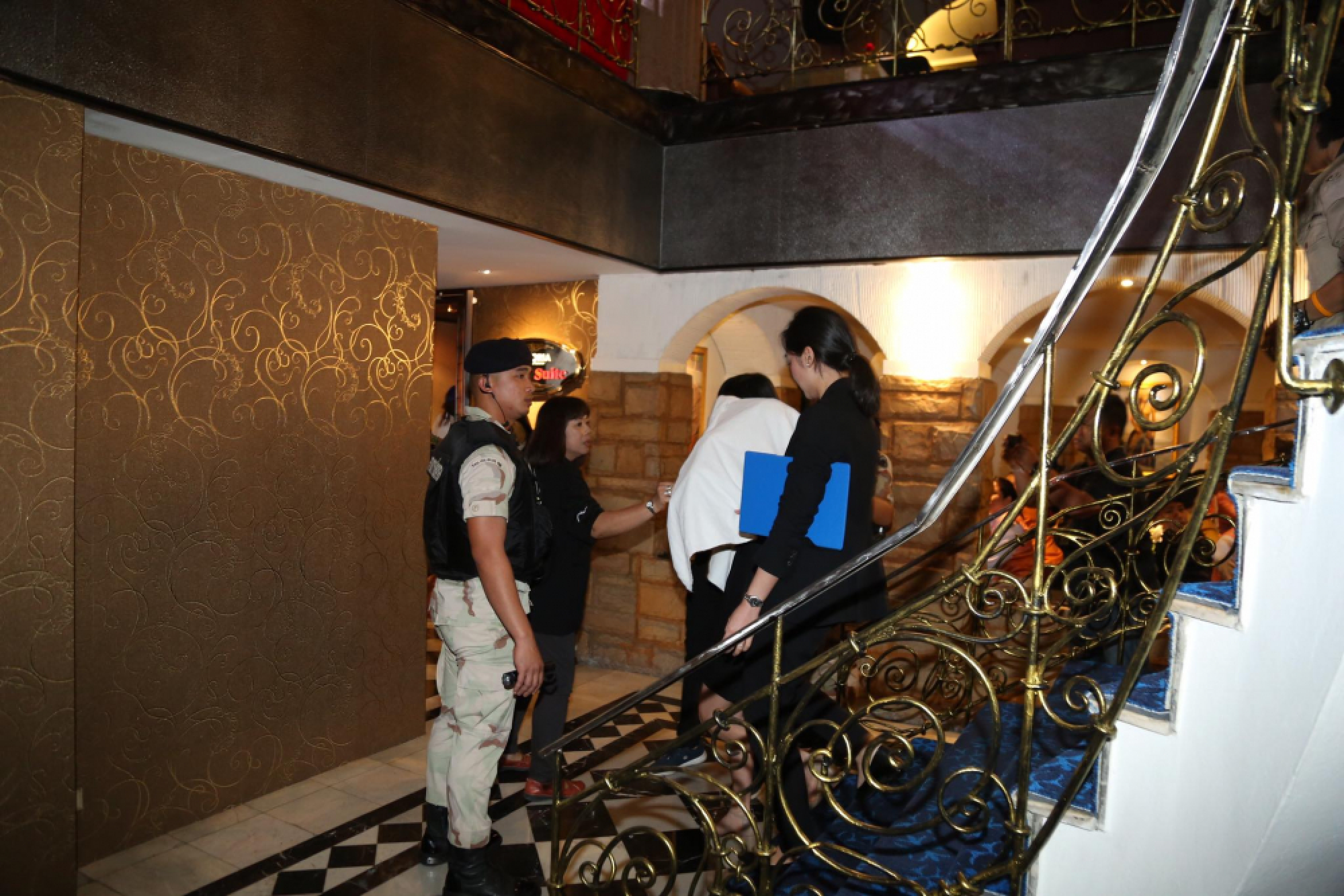 Licence holder of massage parlour at centre of prostitution raid surrenders to police