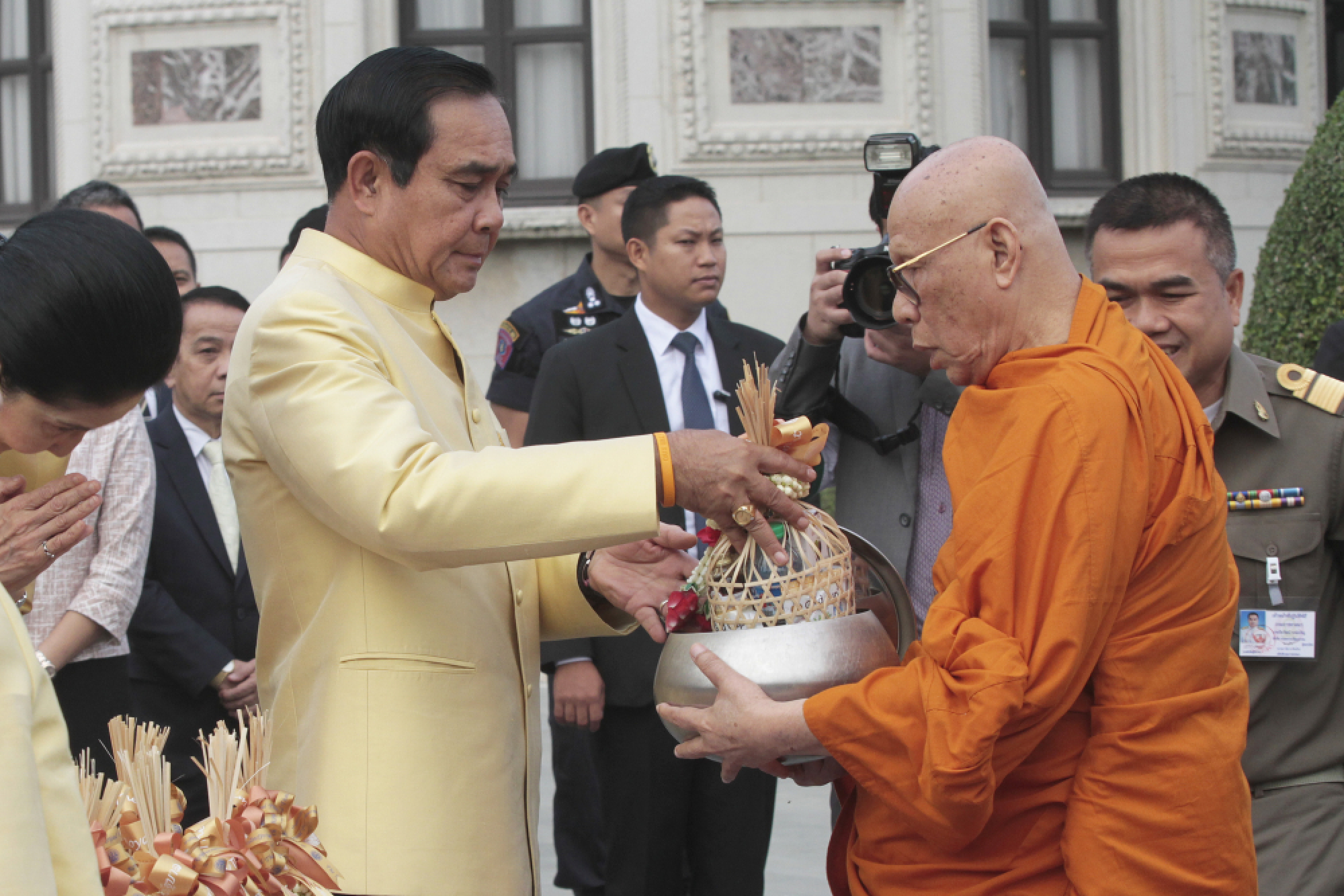 PM, Cabinet give alms to monks before meeting