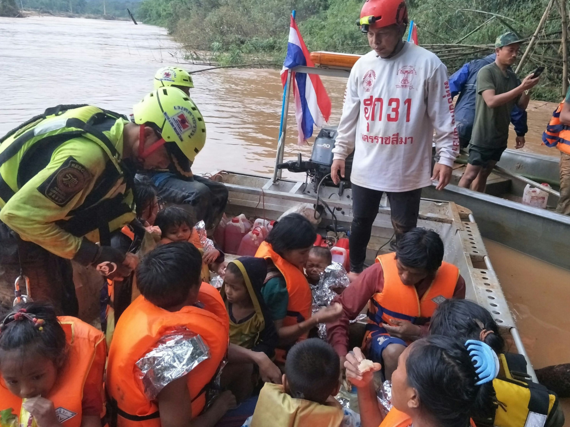 Baby saved from Laos dam disaster by Thai cave rescue volunteers