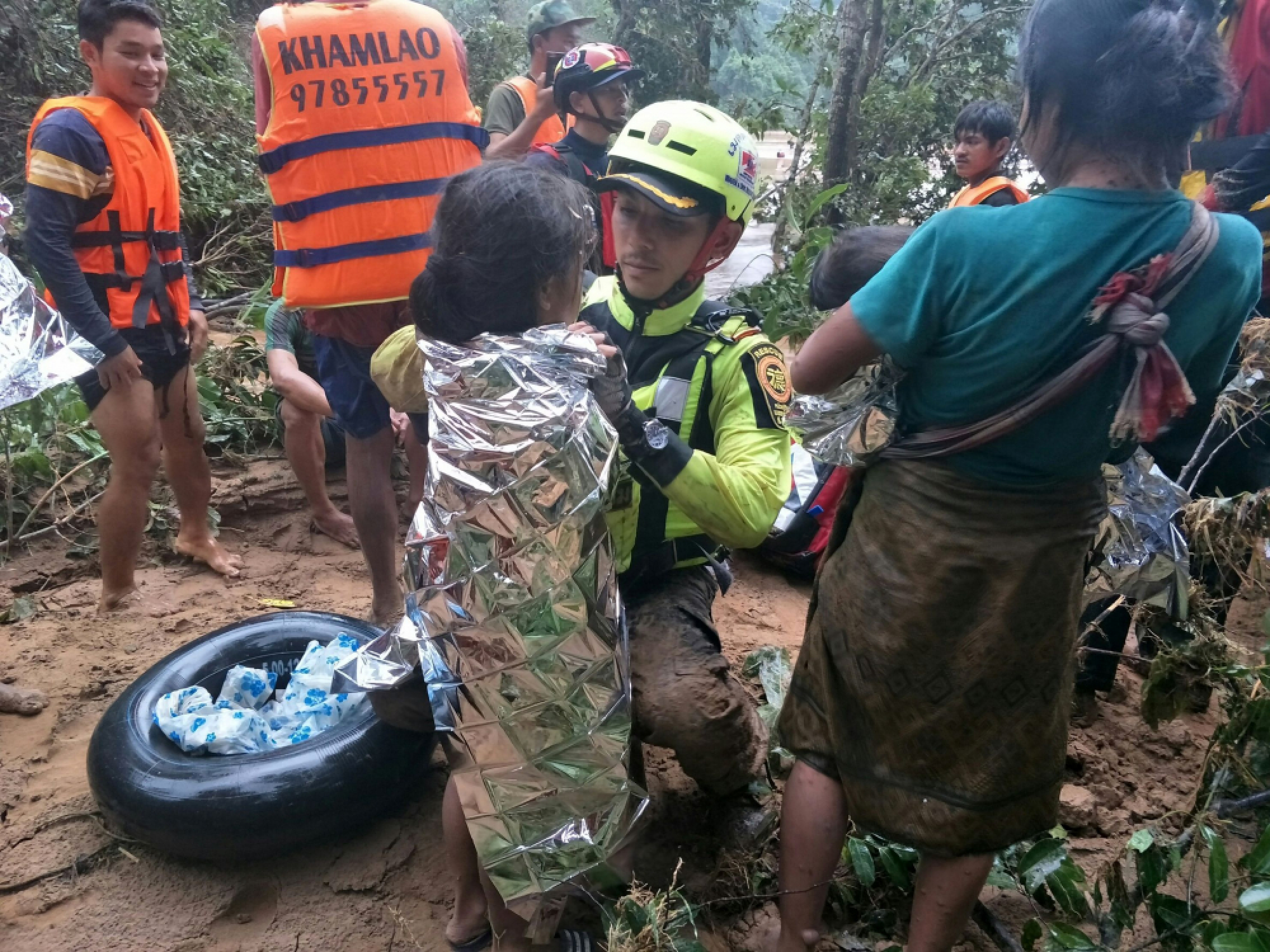 Baby saved from Laos dam disaster by Thai cave rescue volunteers