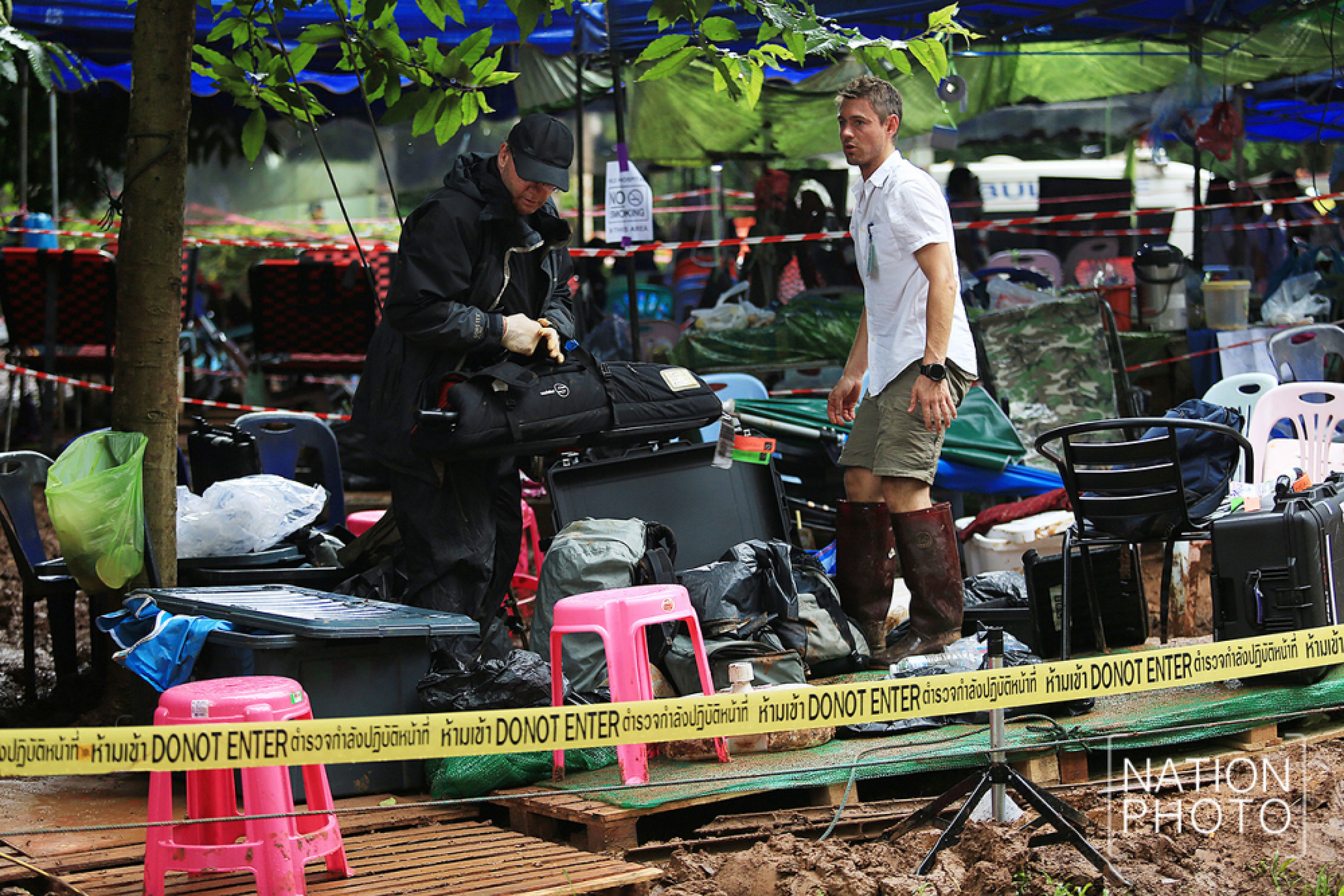 World media moved back from cave as evacuation begins