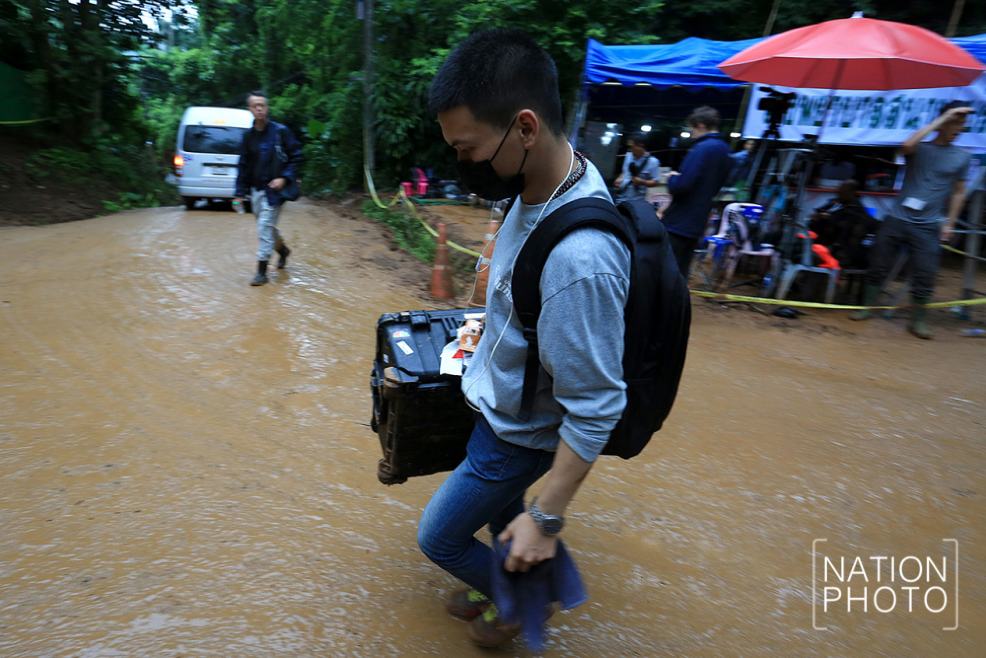 World media moved back from cave as evacuation begins