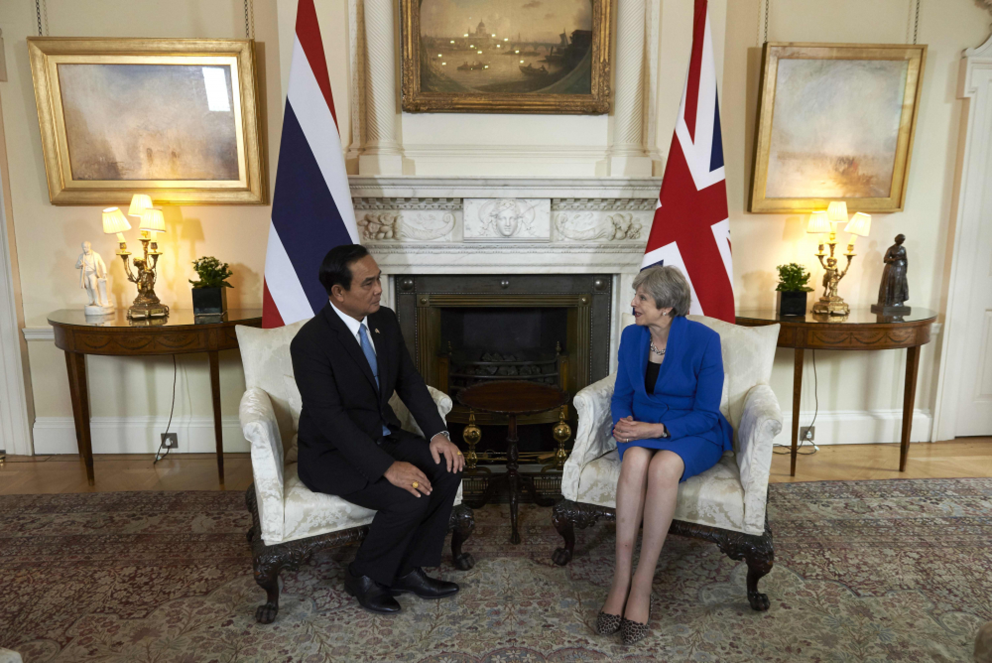 May presses PM on free and open elections