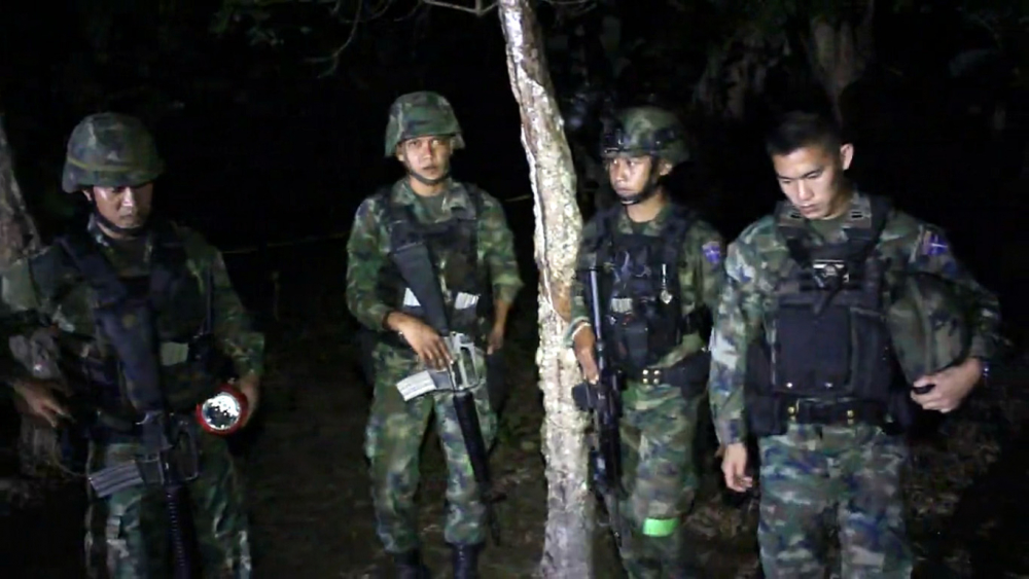 Mother shot dead in Narathiwat, daughter weeps by her body