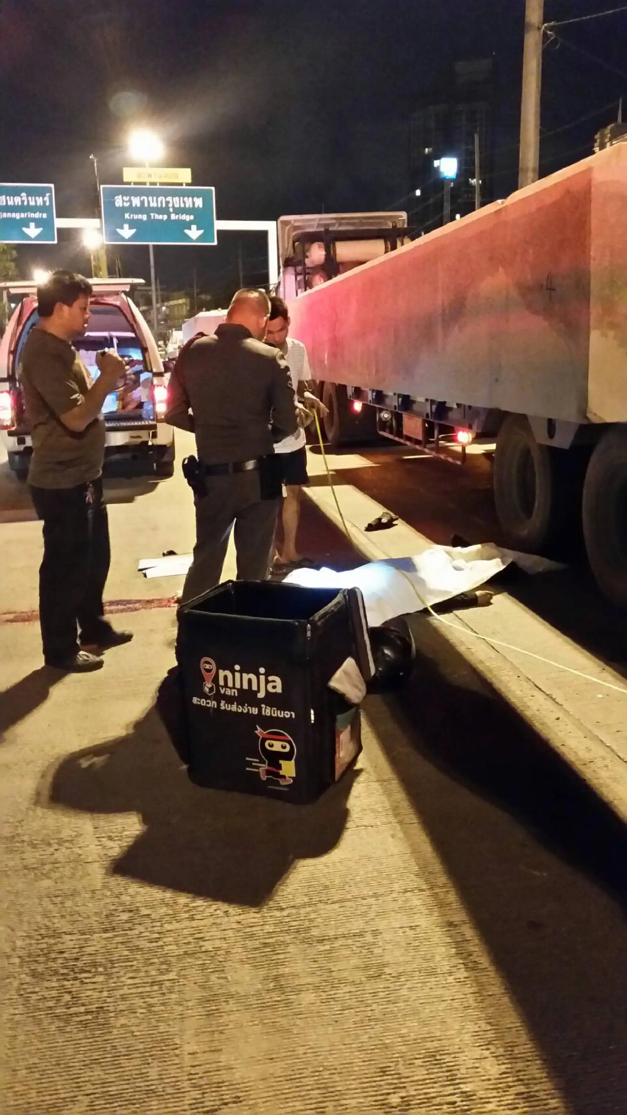 Messenger killed as motorbike hits Bangkok construction barrier