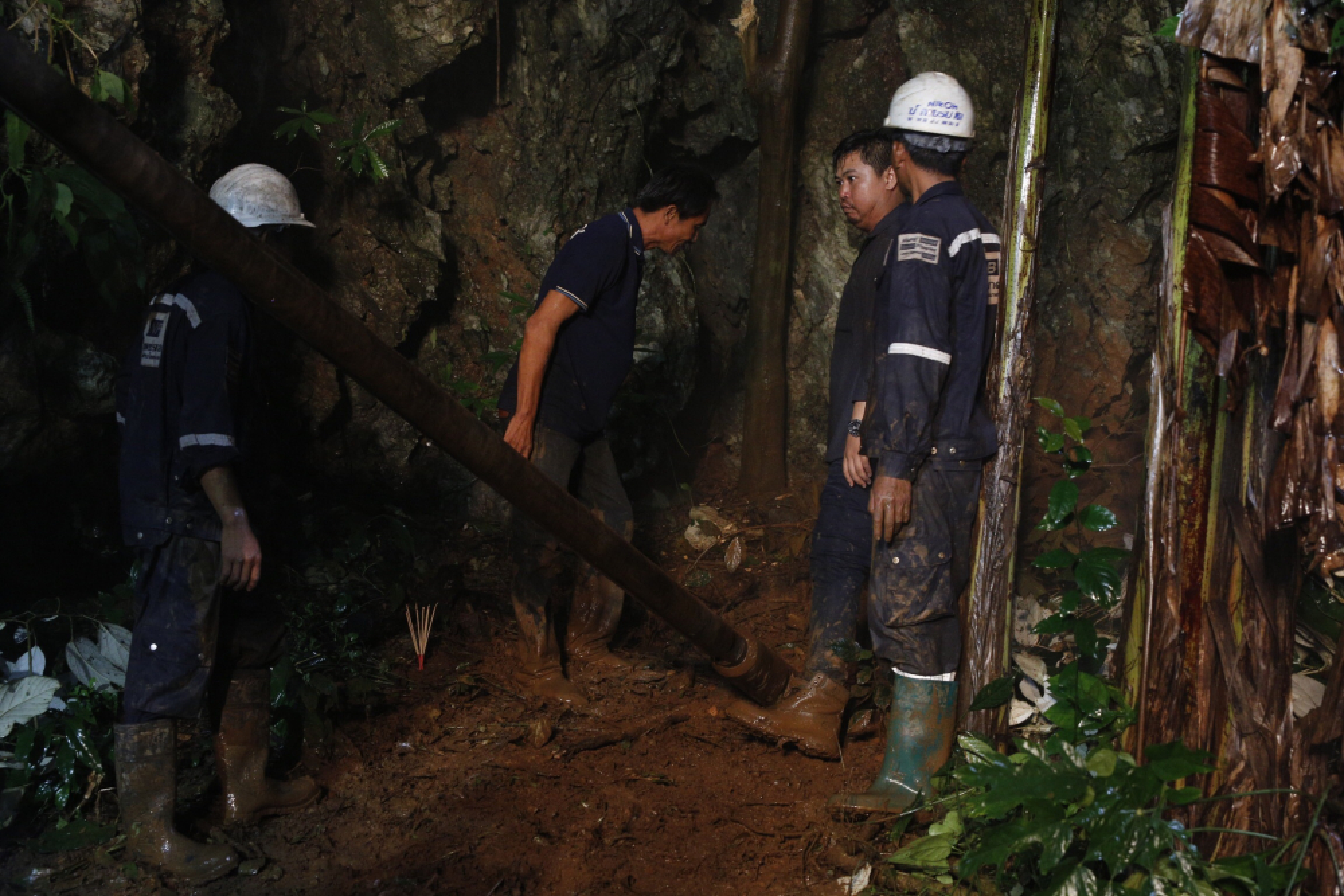 Rescue workers begin drilling in desperate bid to drain cave