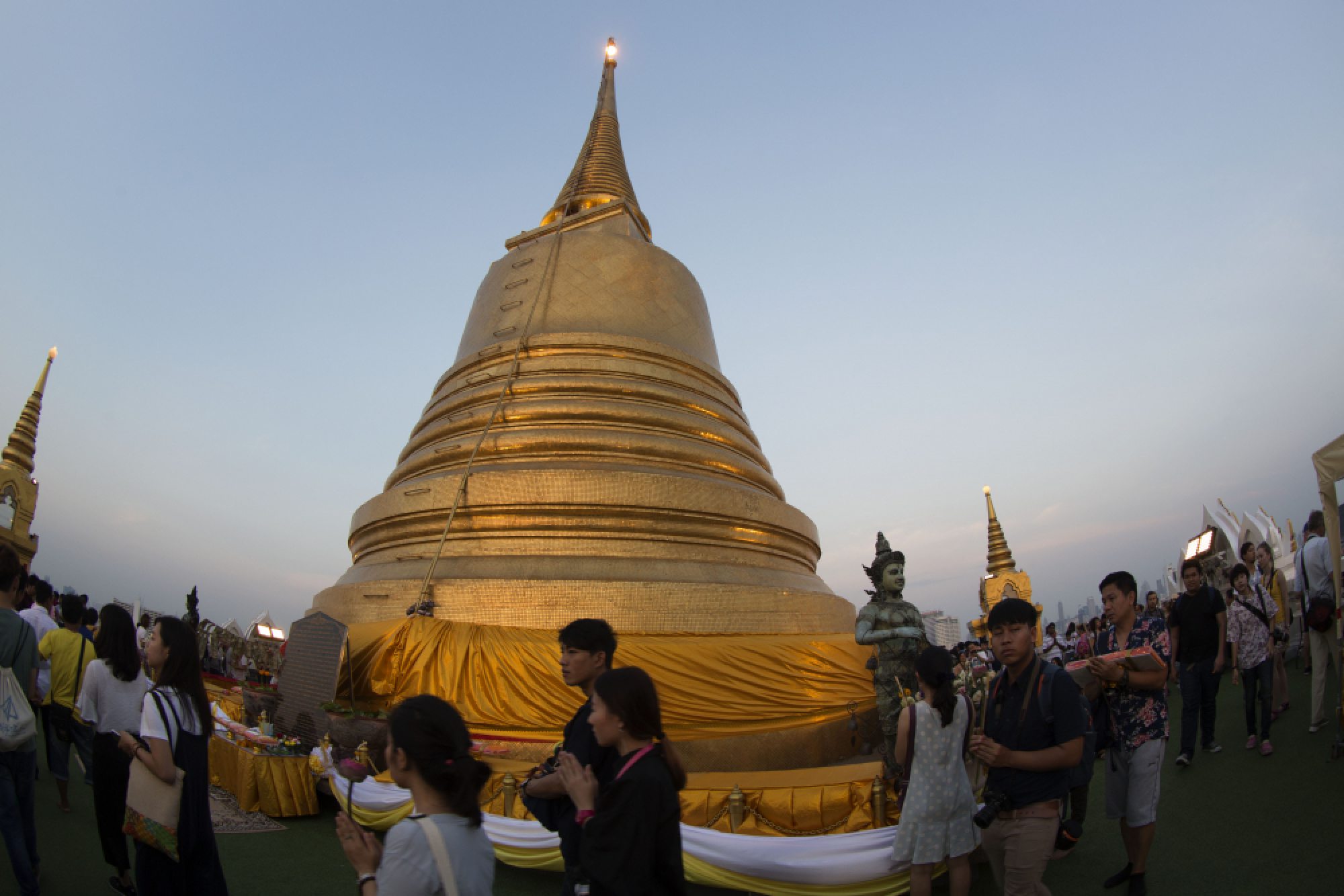 Buddhists take part in a candle-lit circumambulation ceremony to mark Makha Bucha Day