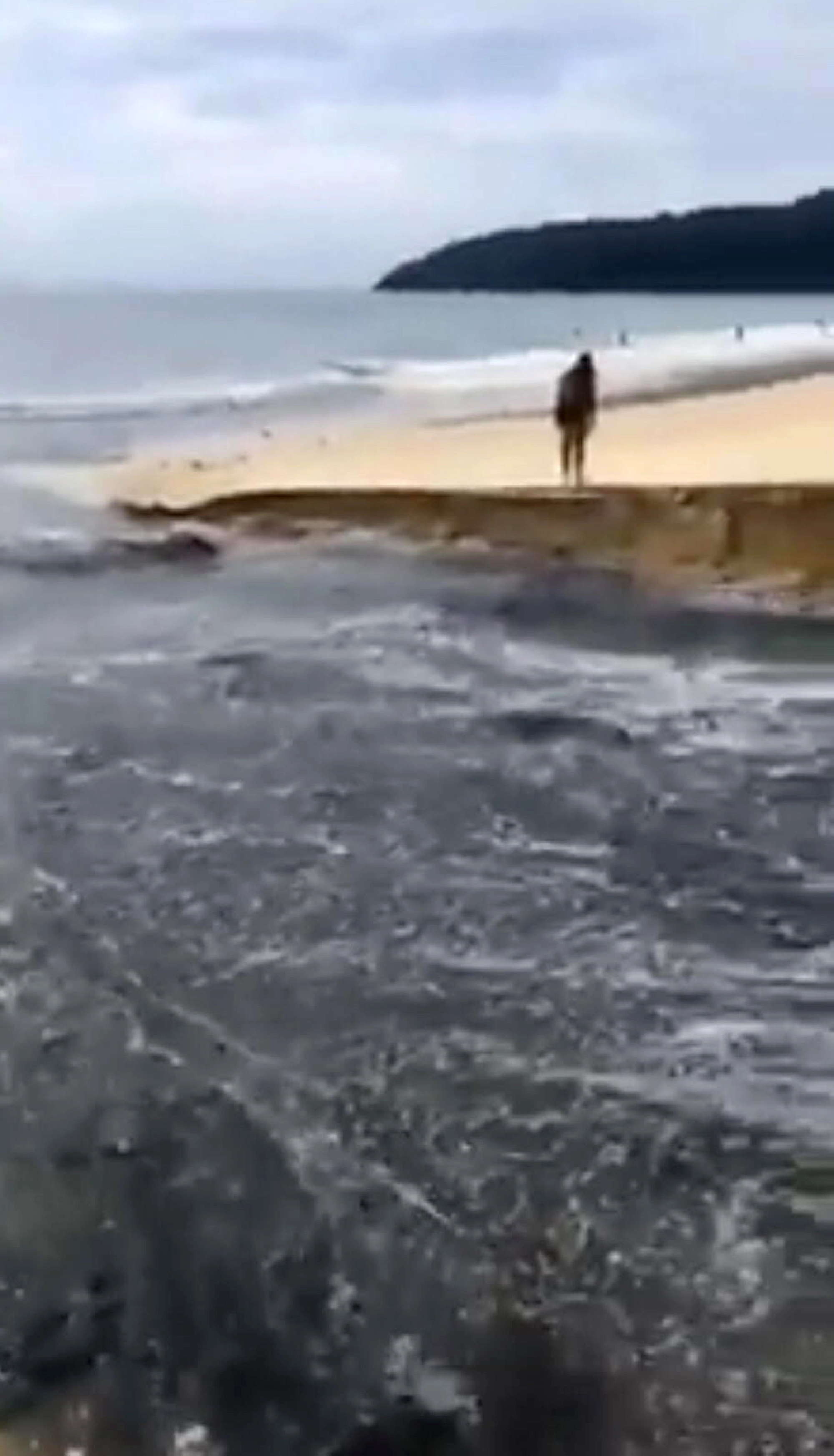 Filthy water flowing on Karon beach