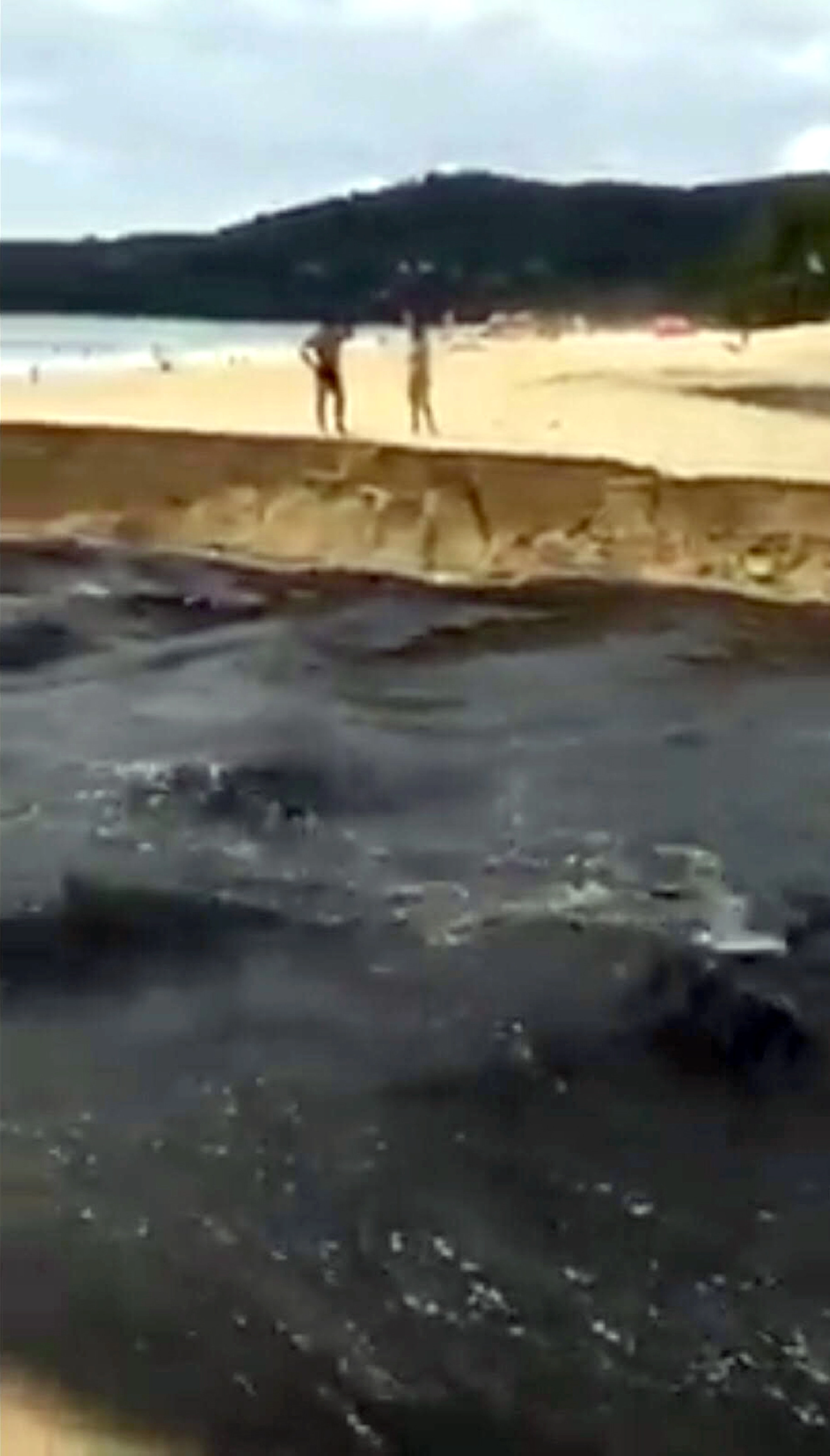 Filthy water flowing on Karon beach