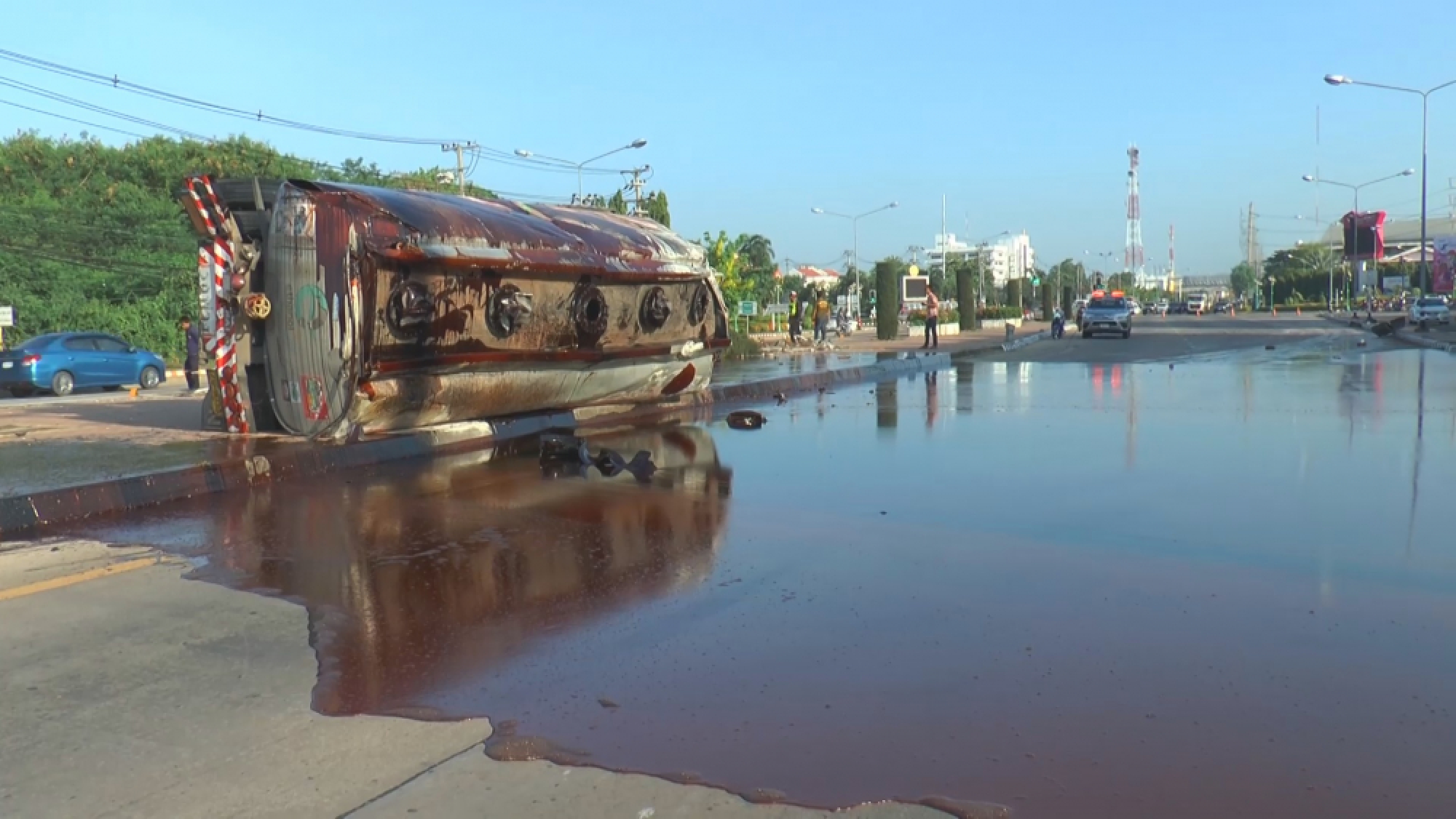 Tanker overturns, paves road with big molasses spill