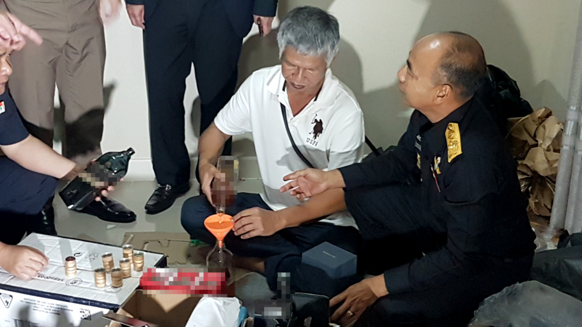 Malaysian, Thai arrested in Samut Prakan for making fake-brand booze