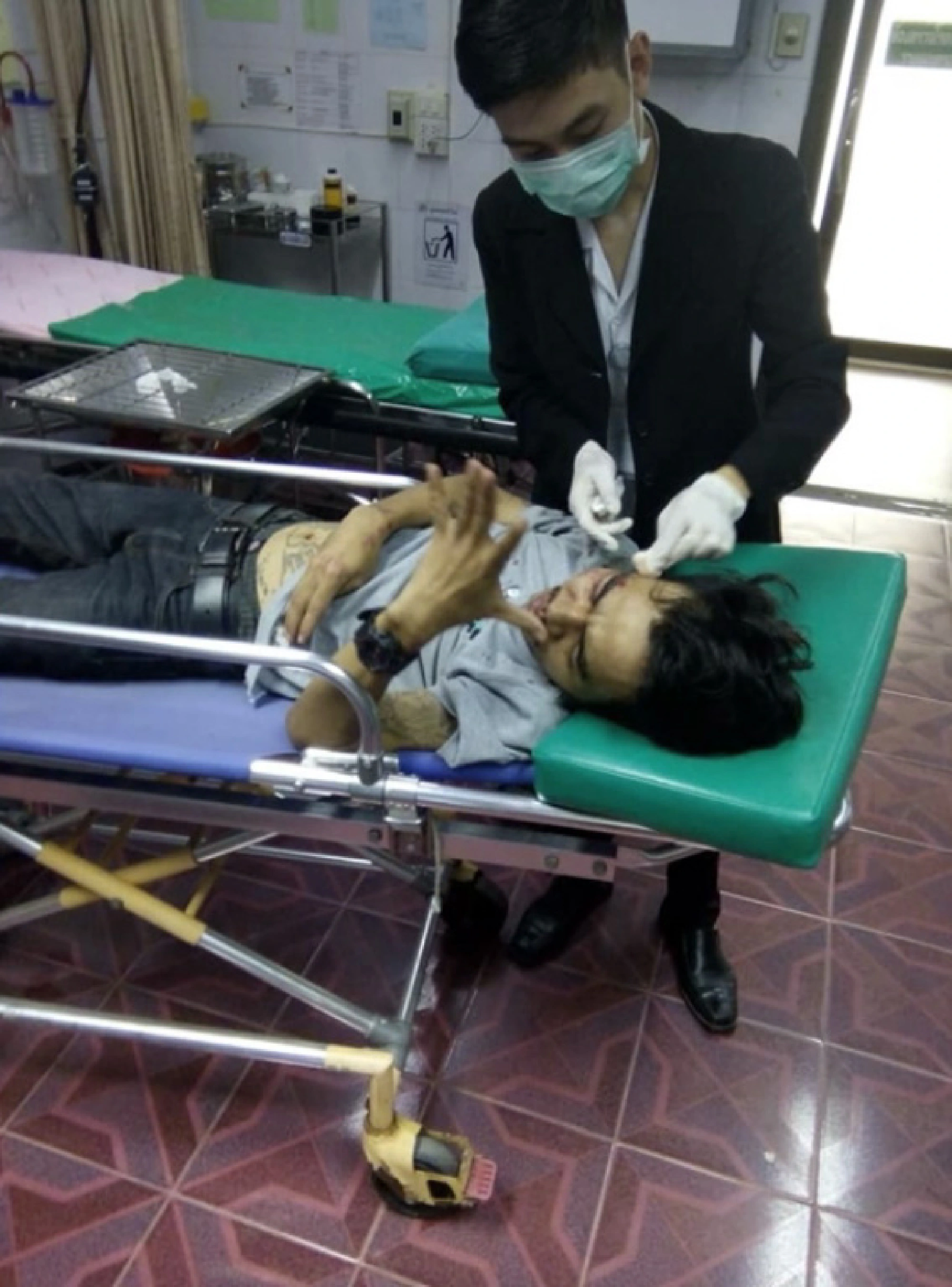 Two injured as hanging fibre-optic cable catches motorcyclist's neck