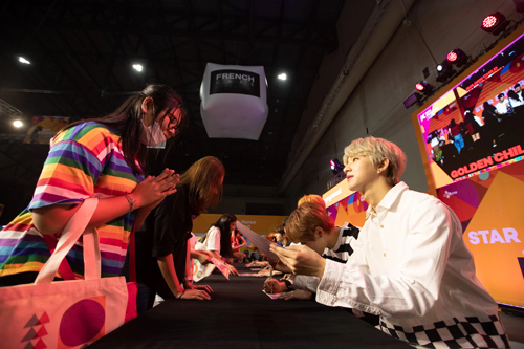 K-pop onstage, girls in puddles