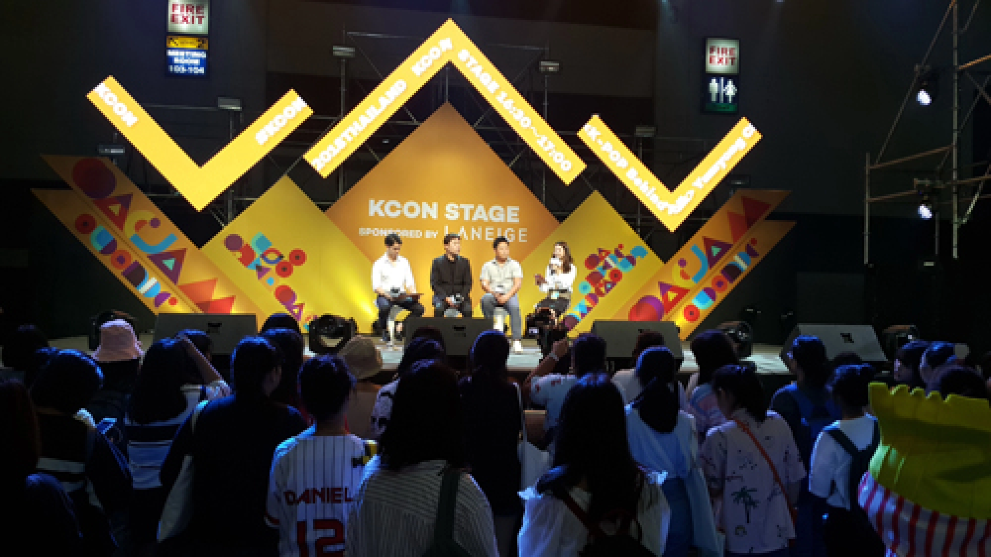 K-pop onstage, girls in puddles