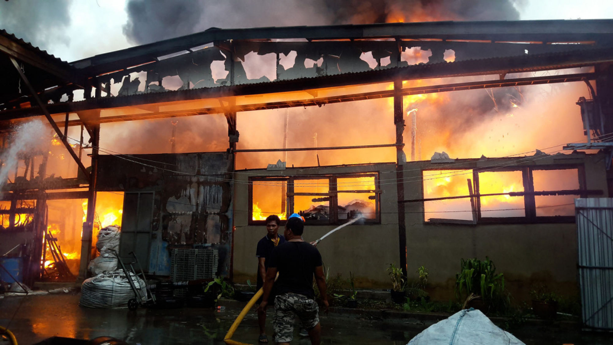 One injured in massive blaze at plastic pellet factory, chemical warehouse