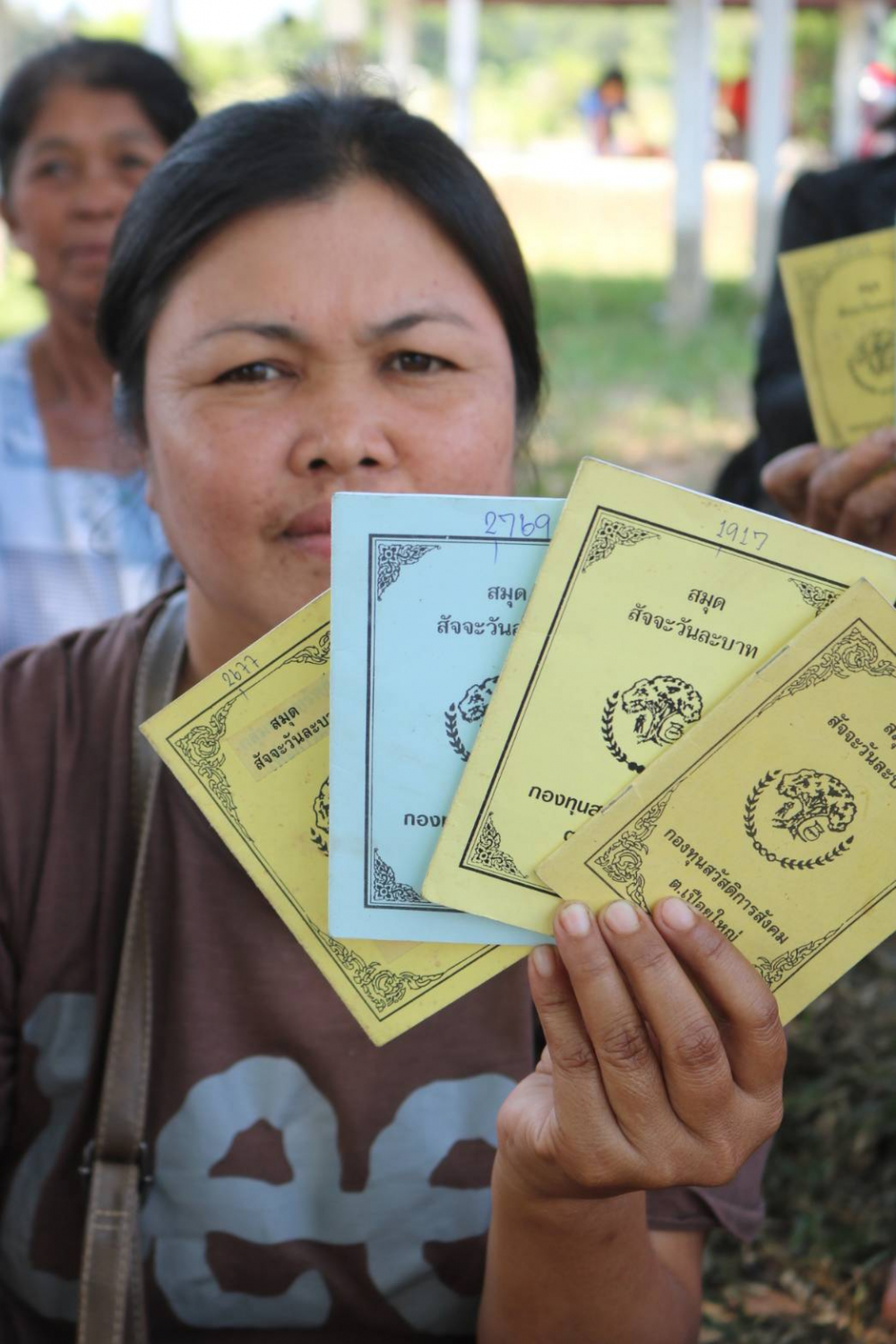 Khon Kaen villagers step up protests outside complaint centre over Bt10m loss