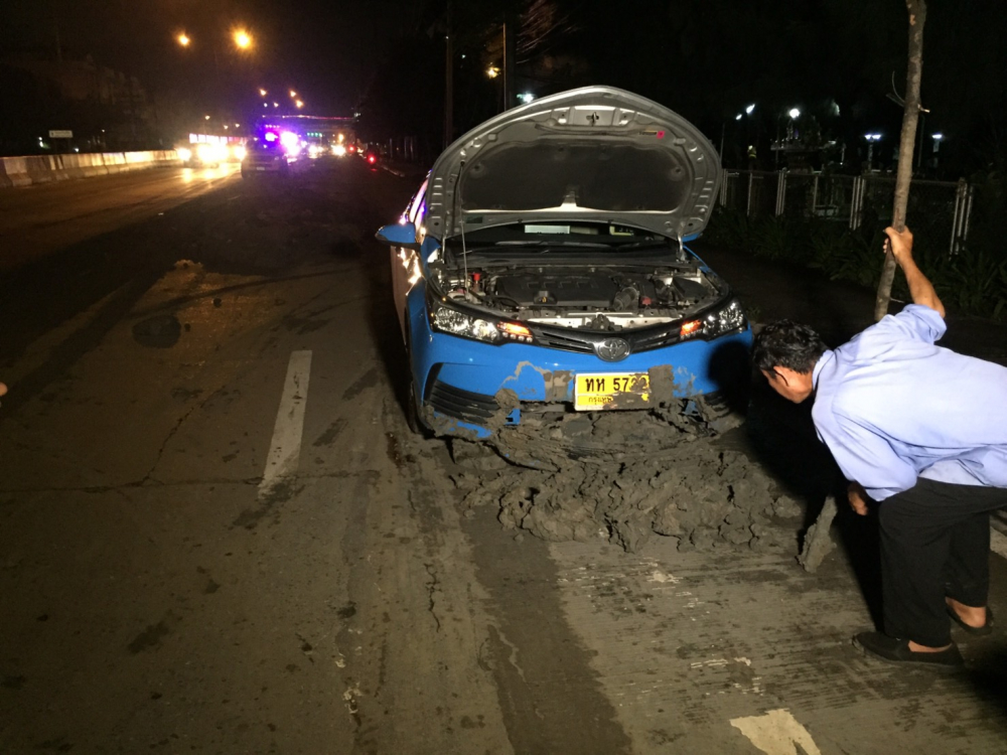 Cars, motorcycles hit trouble after truck spews mud slick across Bangkok road