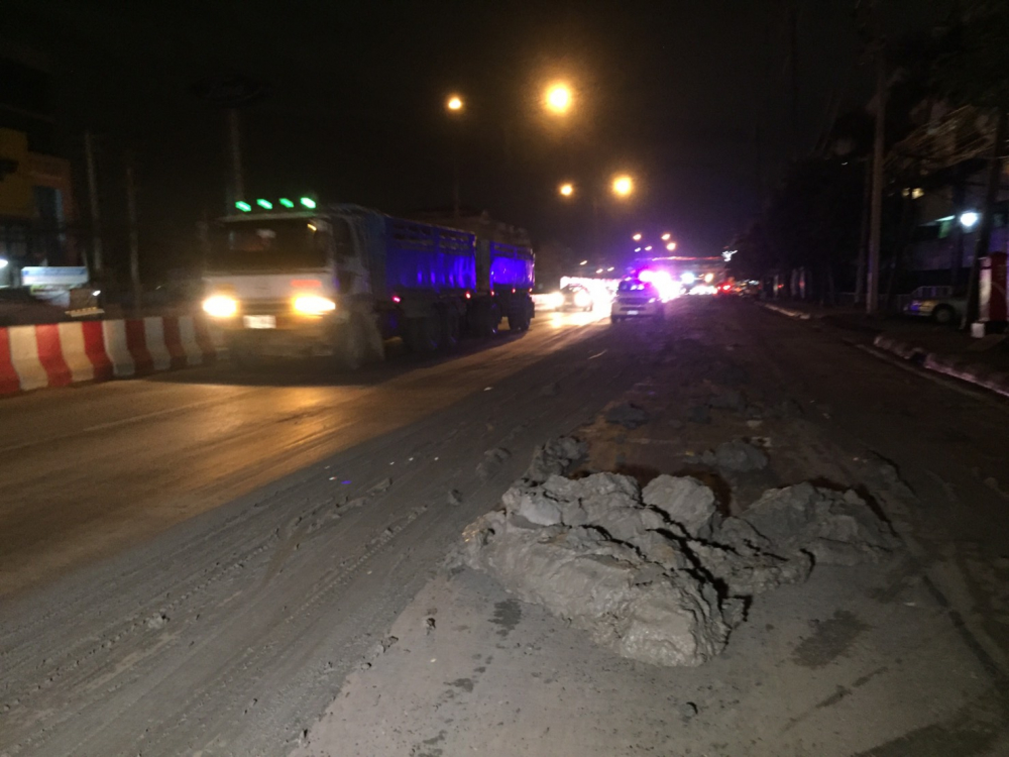 Cars, motorcycles hit trouble after truck spews mud slick across Bangkok road