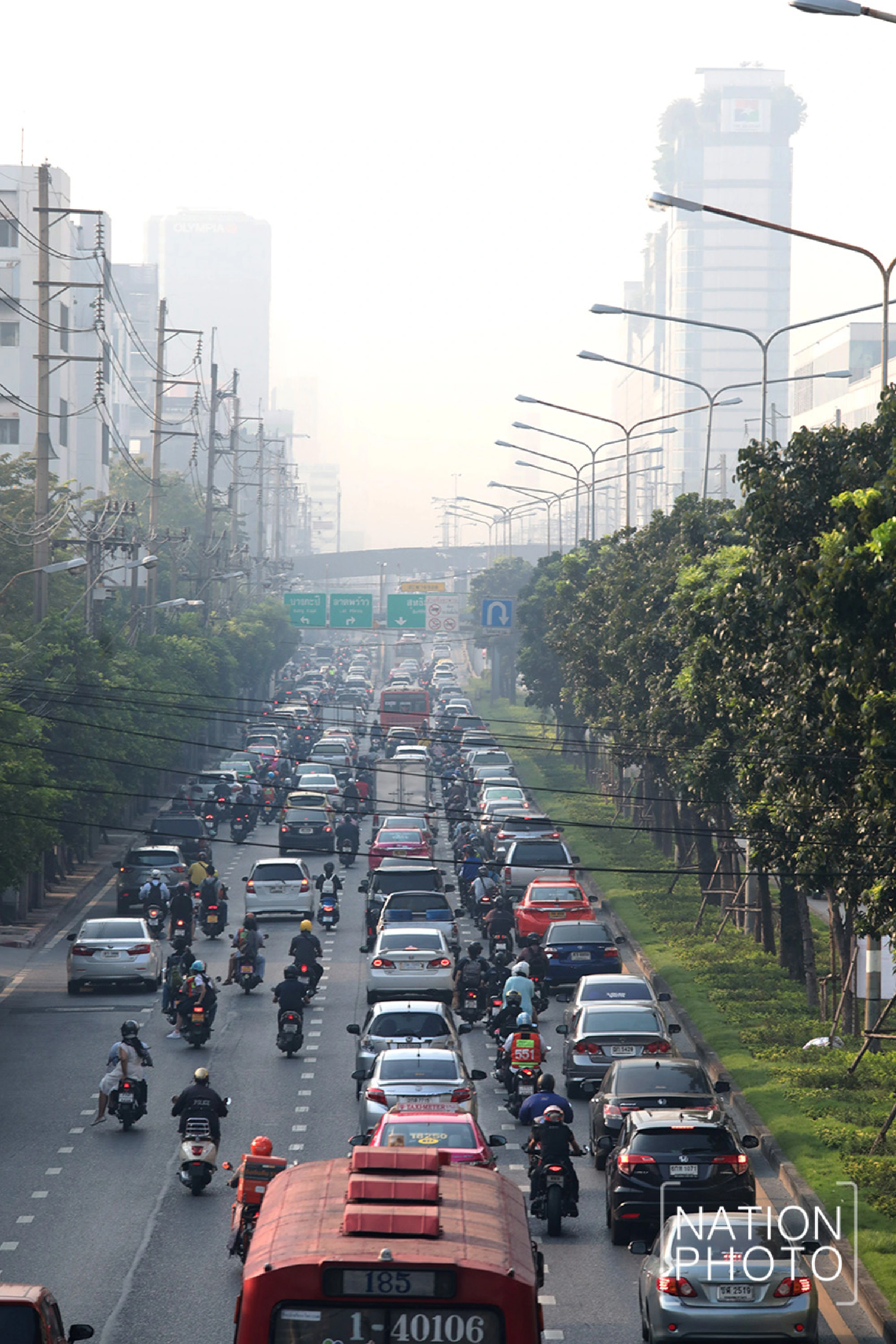 Windless Bangkok strangles in smog, but forecast improves
