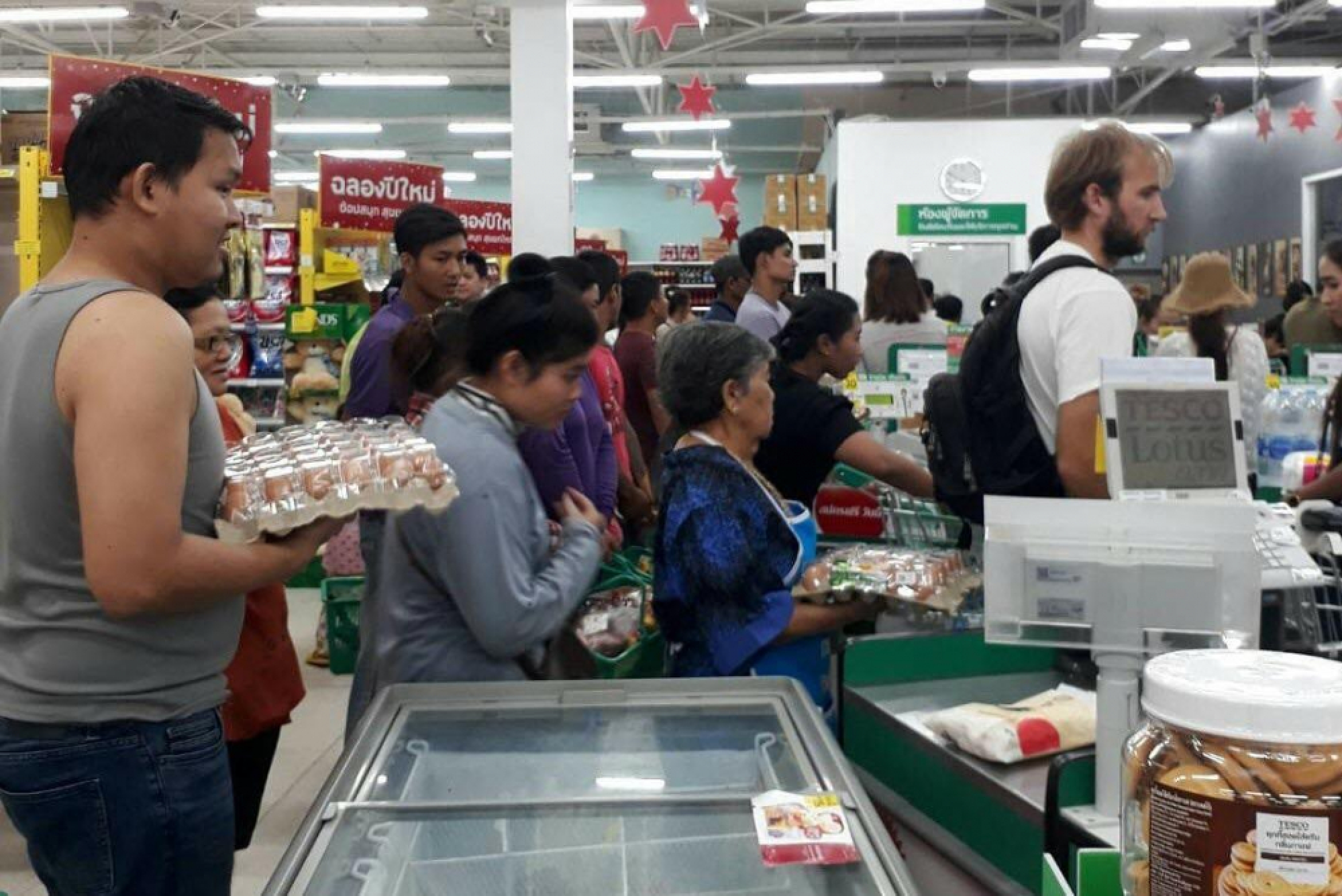 People stock up on food and basic supplies