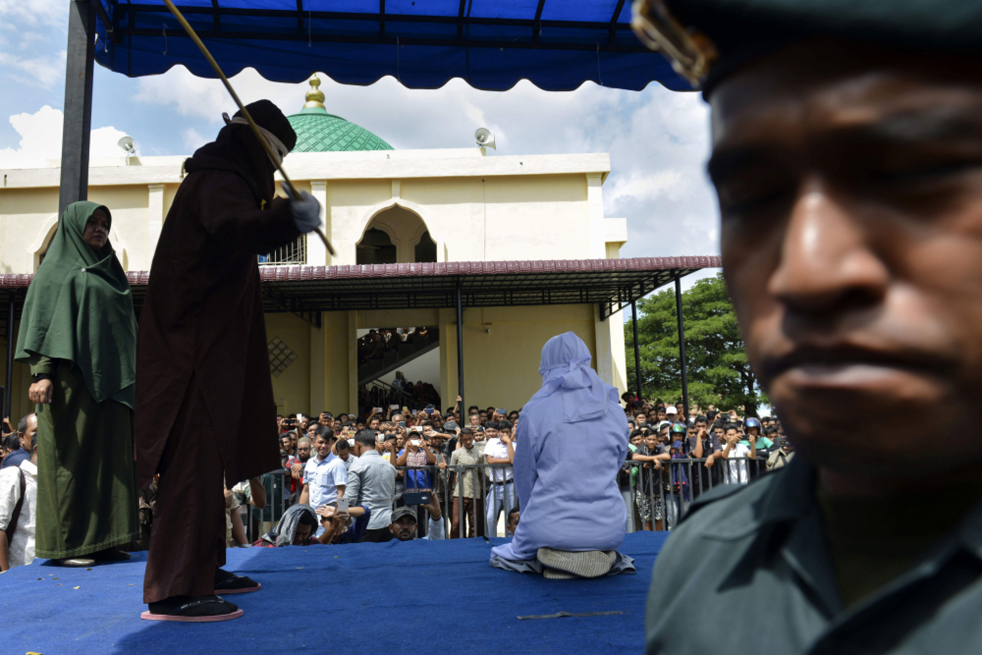 Indonesia's Aceh whips teens for public cuddling