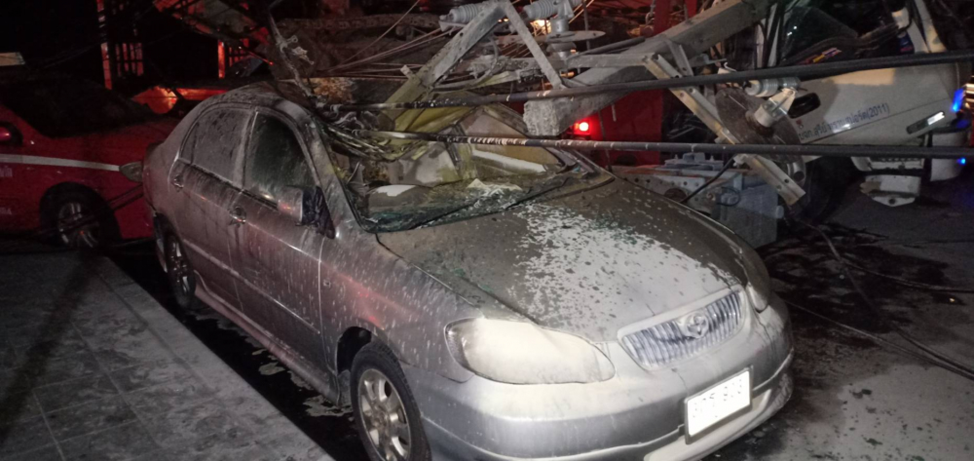 Electricity pole falls on truck and car in Bangkok