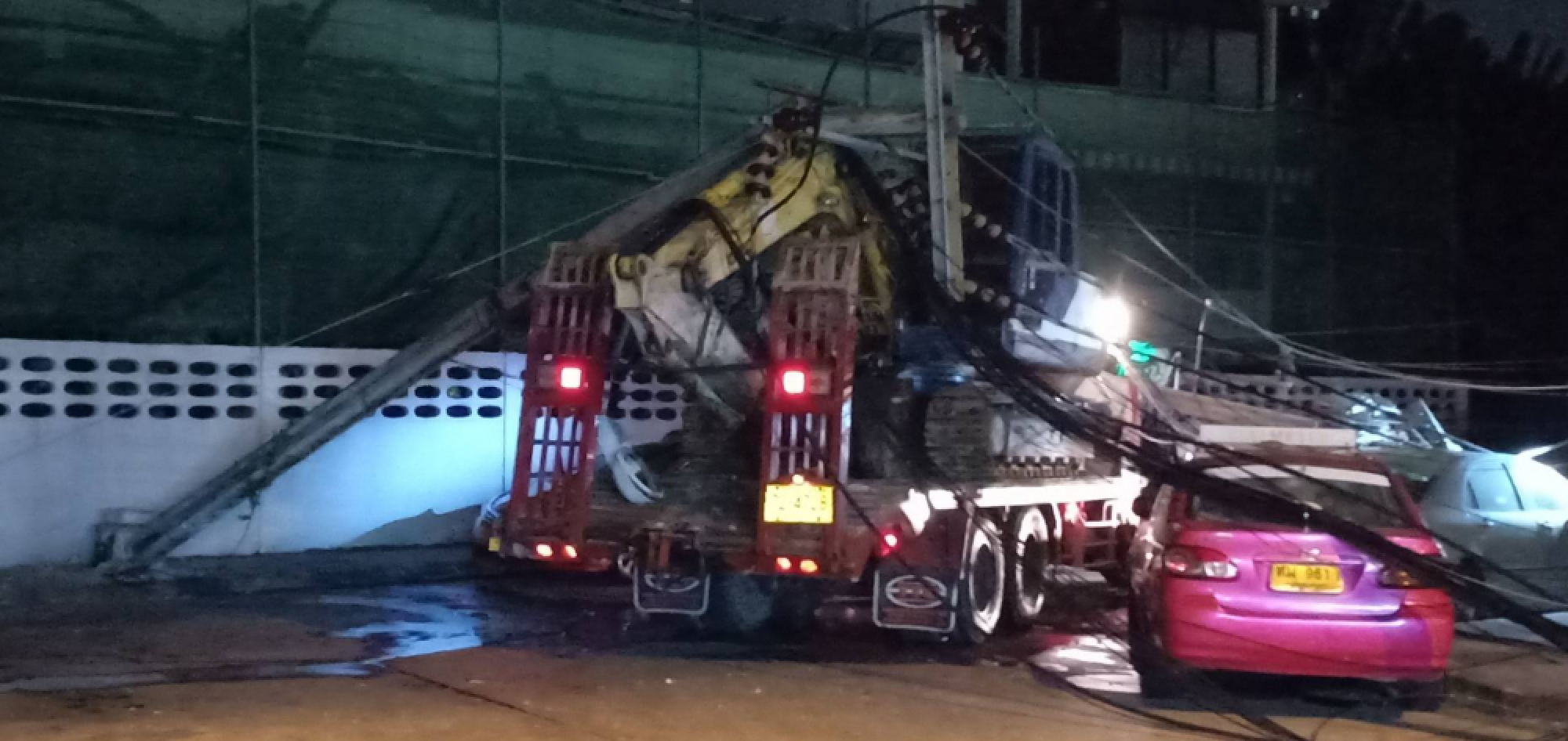 Electricity pole falls on truck and car in Bangkok