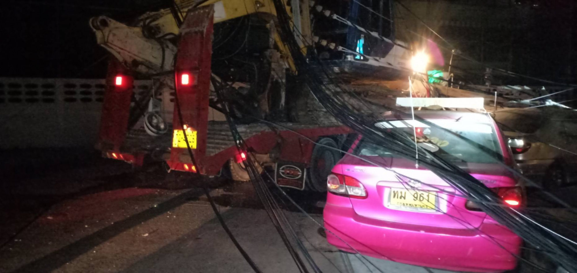 Electricity pole falls on truck and car in Bangkok
