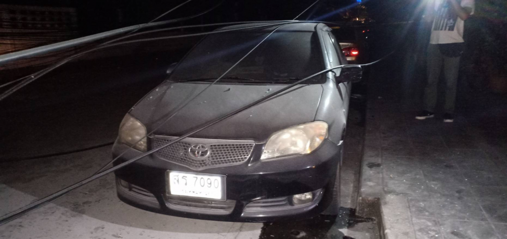 Electricity pole falls on truck and car in Bangkok
