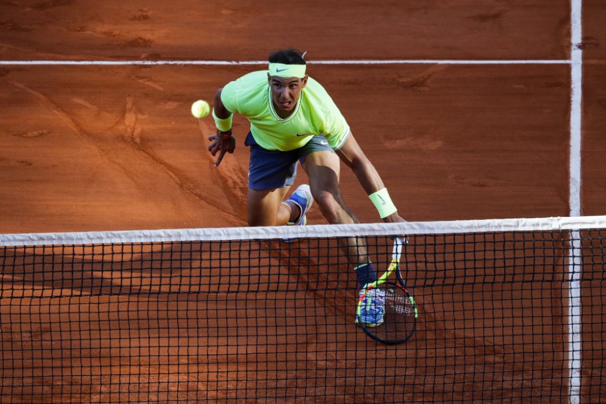 Federer, Nadal reach French Open fourth round, Pliskova out