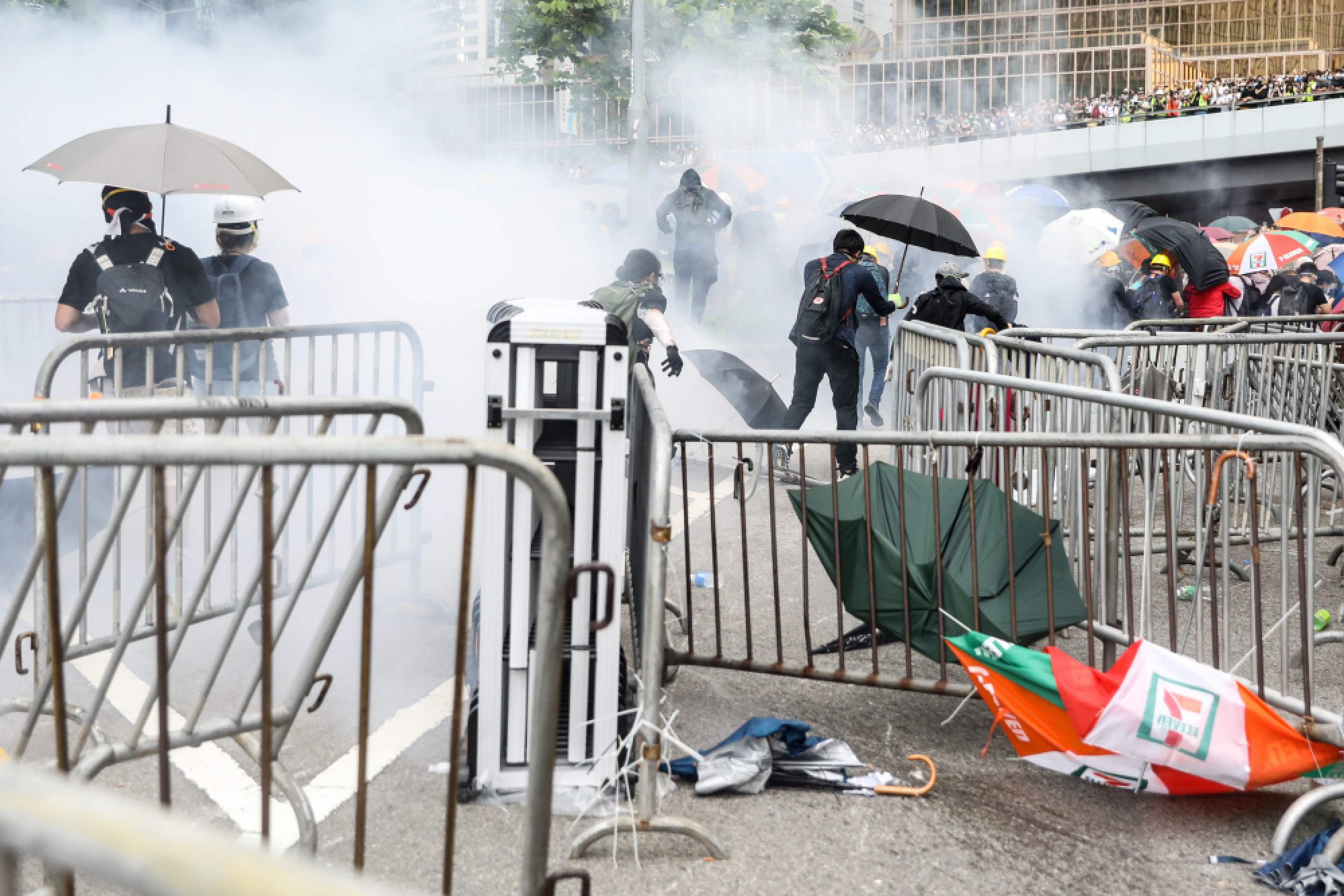 Hong Kong police use tear gas as protesters try to storm parliament