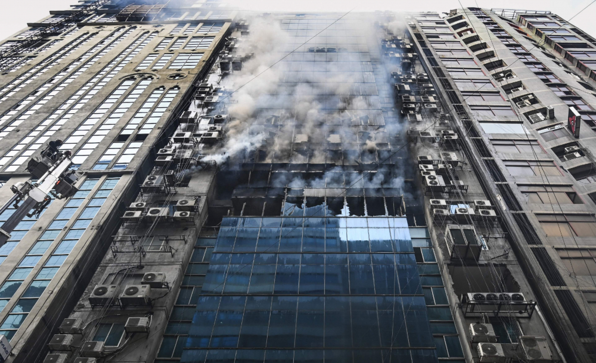 Workers jump to their deaths as Dhaka office block fire kills seven