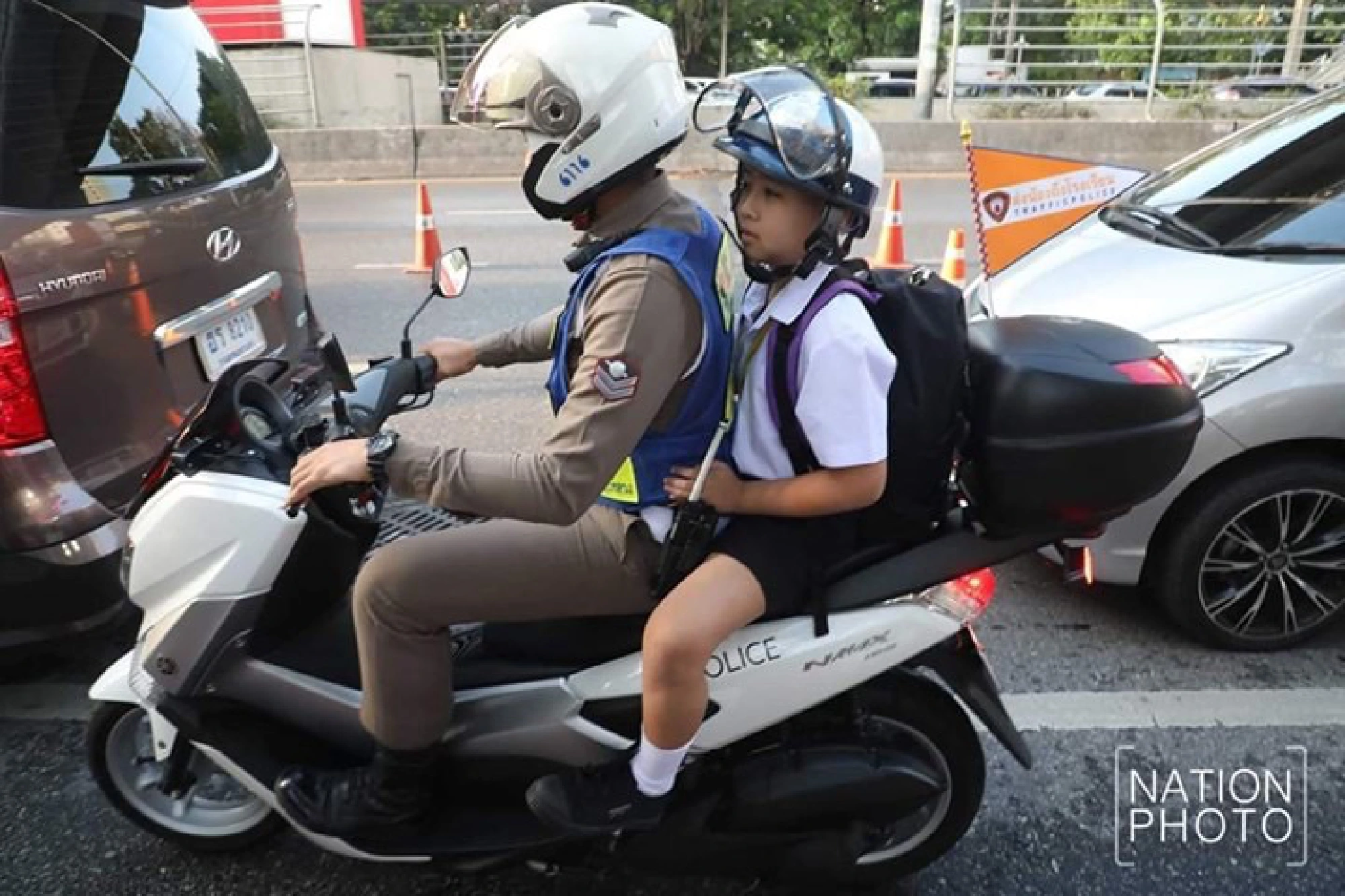 Traffic-busters: Bangkok cops offer kids free rides to school
