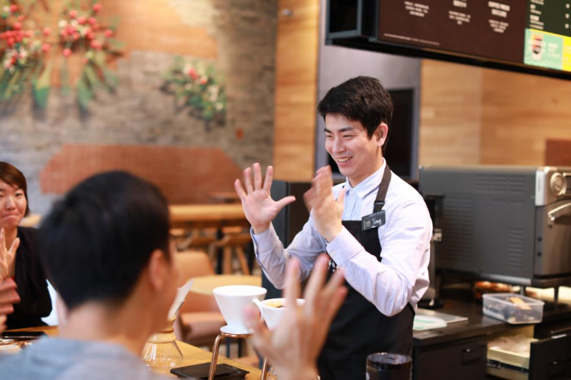 Starbucks opens first store with sign language capability in China