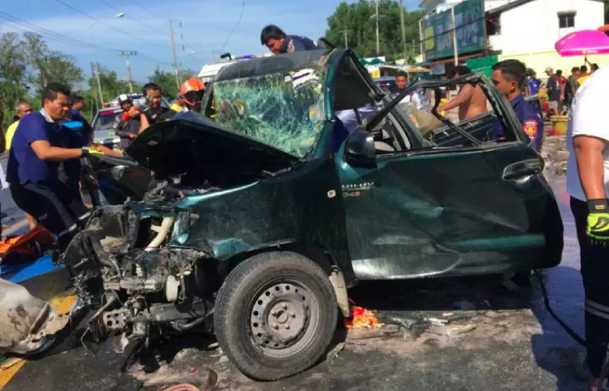 Woman killed, nine people injured in seven-vehicle pileup that covered road with catfish in Nakhon S